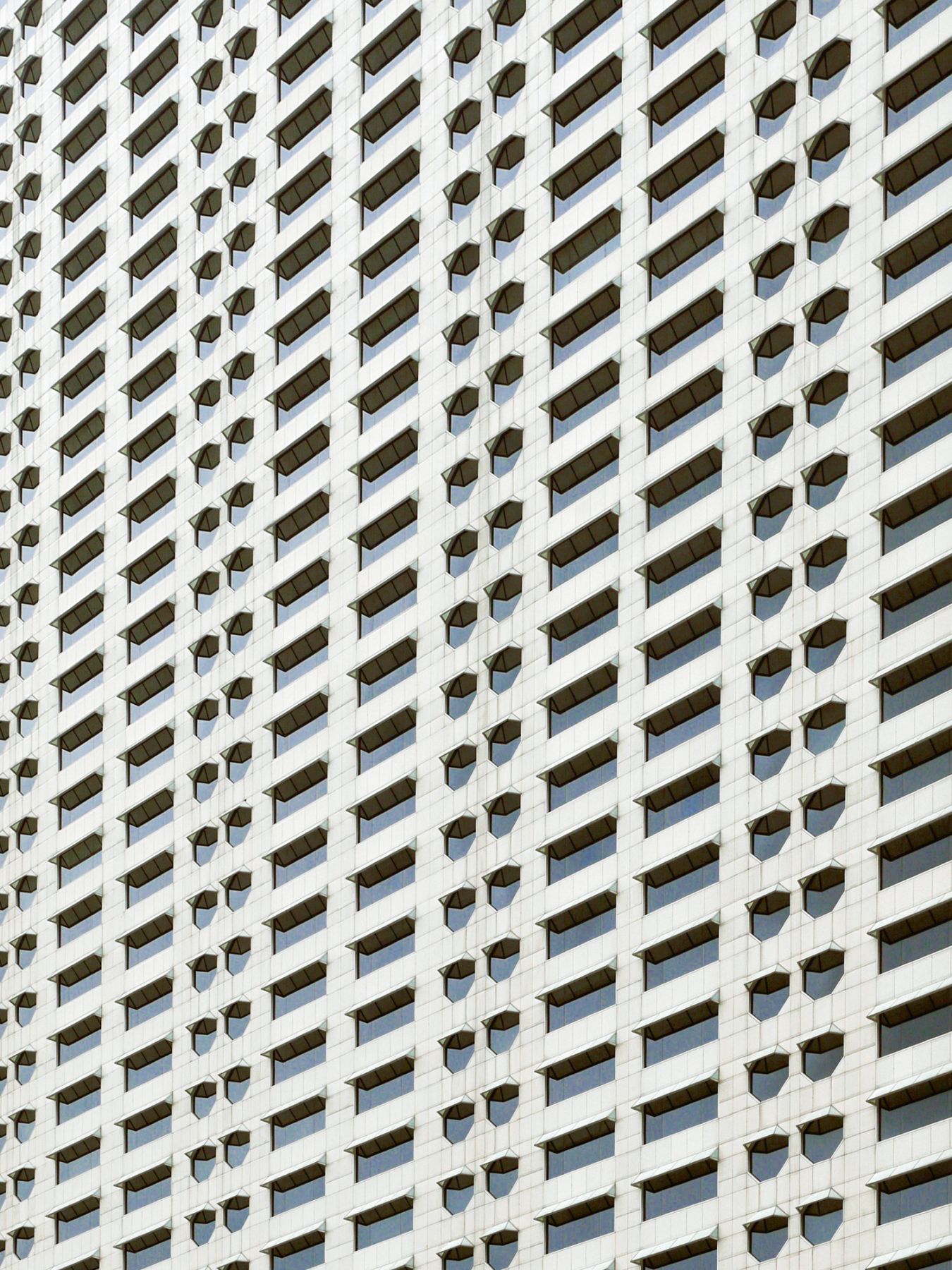 he work of Pritzker prize-winning architect Kevin Roche and DP Architects, the octagonal windows of The Ritz-Carlton, Millenia Singapore are among its distinctive architectural elements (Photography: Danist Soh/Unsplash)