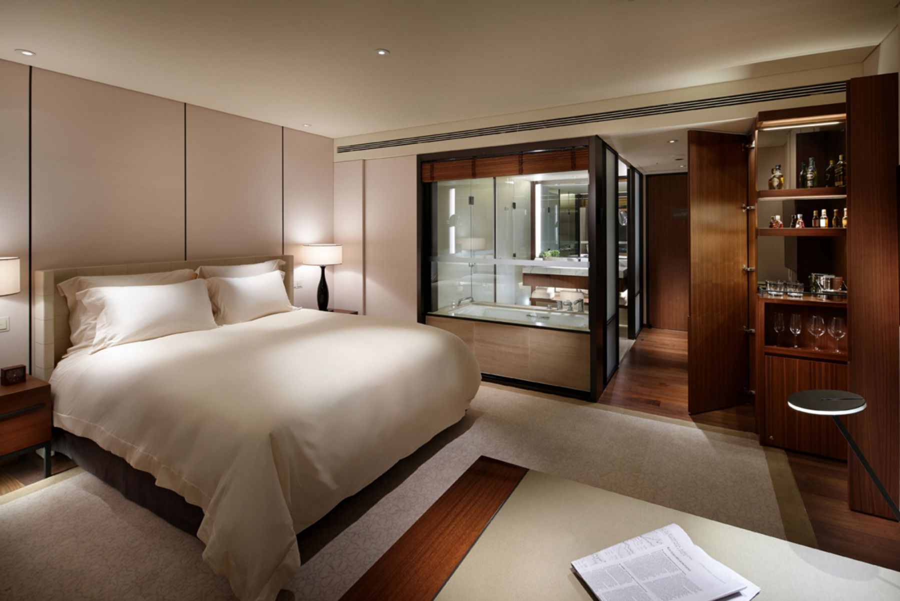 Designed by Peter Remedios, the rooms feature a layered look with the use of mahogany wood and soft linens (Image: Courtesy of The Shilla Seoul)