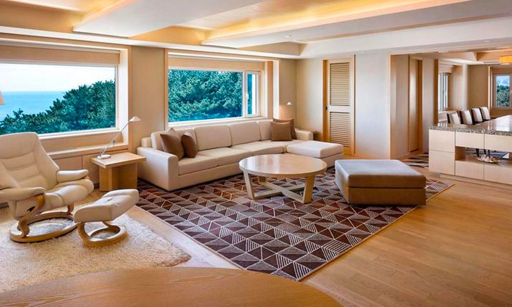 The living area of the presidential suite in The Westin Chosun Busan, which features a minimalist design approach (Image: The Westin Chosun Busan)