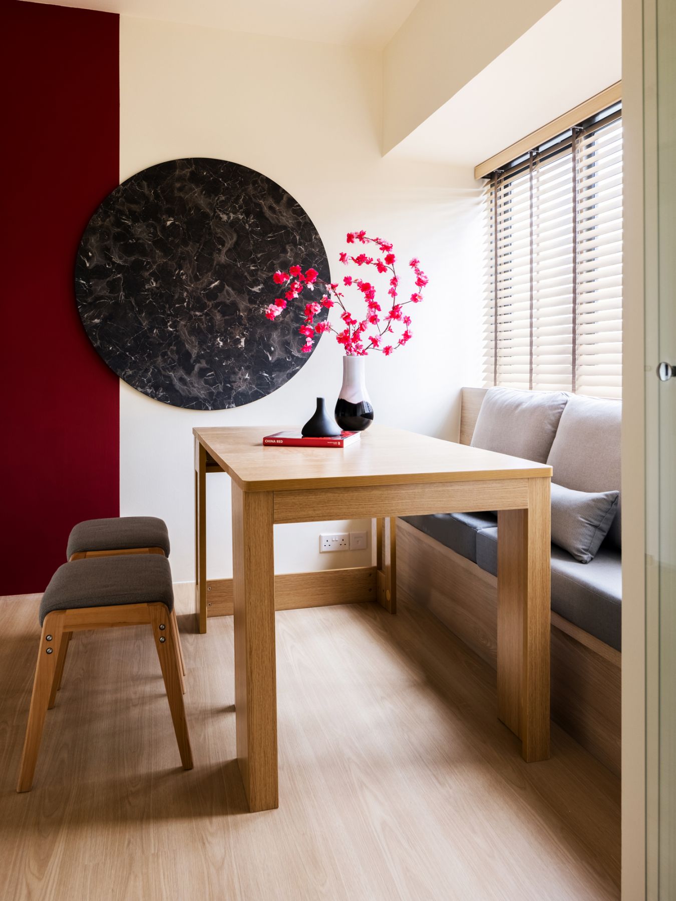 The design team cleverly utilised the bay window space as a dining bench