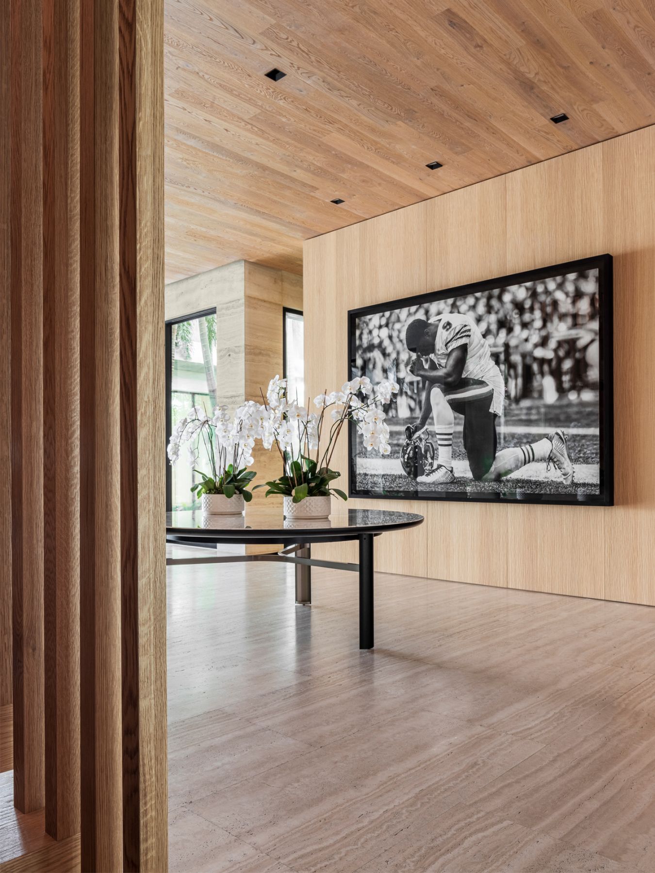 The home is furnished with multiple artworks like this charcoal drawing by Robert Luongo; <i>Untitled (First Amendment)</i> (2018) depicts a fictional NFL player but is based on American football players who began kneeling during the national anthem in 2016 protest of police brutality against people of colour.