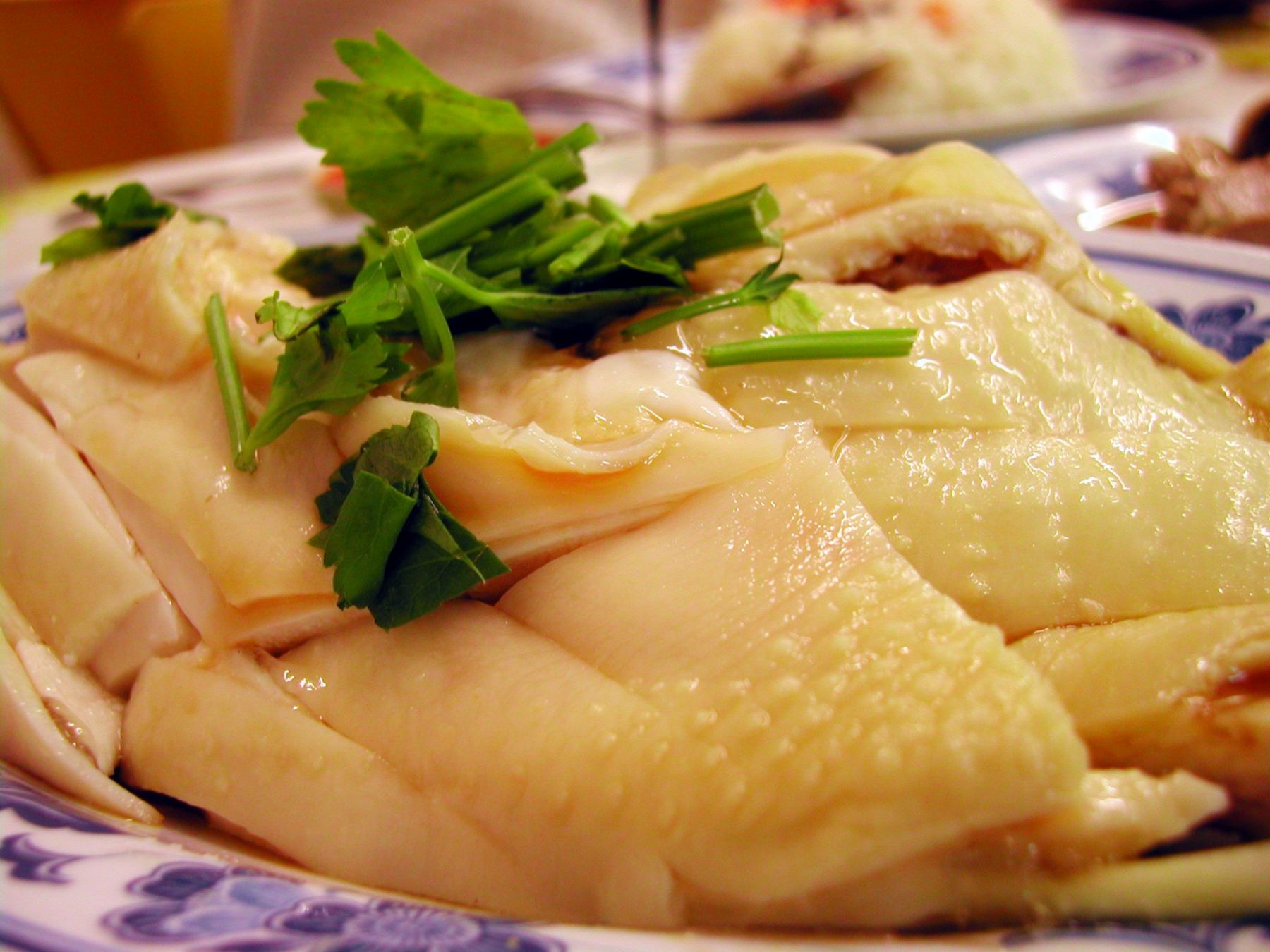 One of Singapore and Malaysia's top loved dishes and you will find Hainanese Chicken Rice in every street corner coffee shop and food court as well as in the coffee houses of all hotels in Singapore. These are kampung (Free Range) chickend - they are supposed to be leaner and meaner!