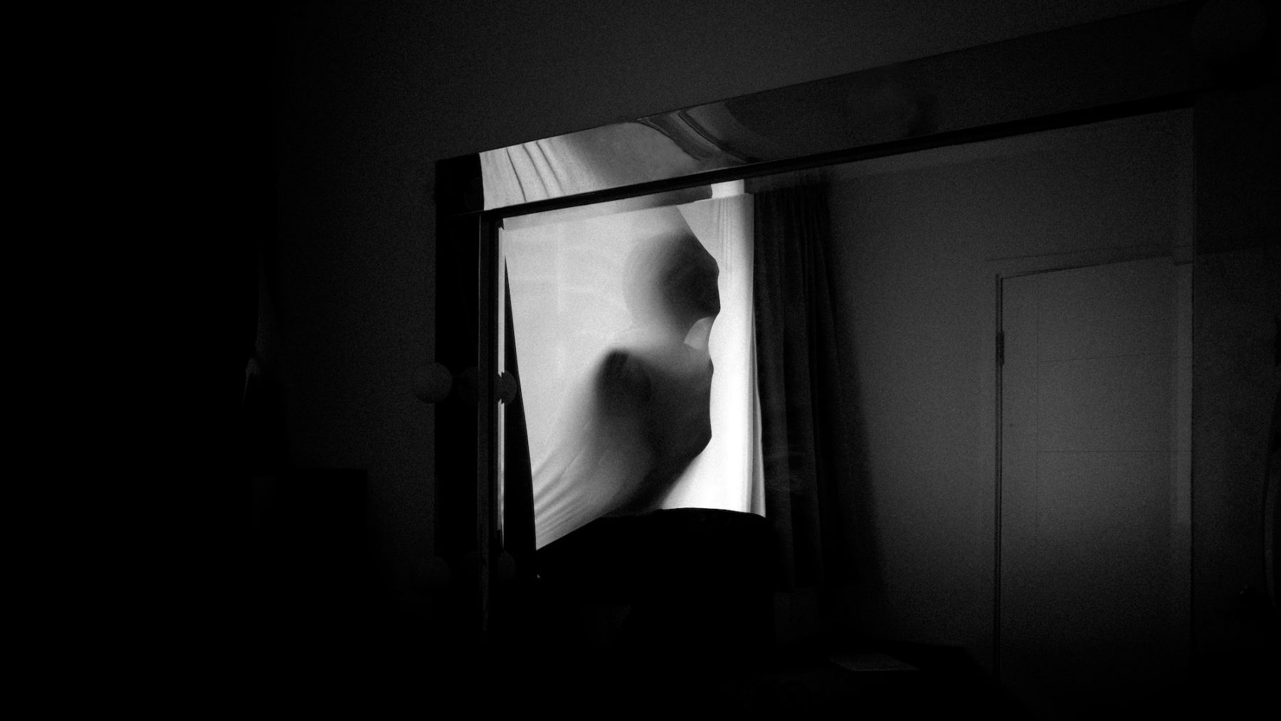 Black and white silhouette of a female figure by photographer Stephanie Teng