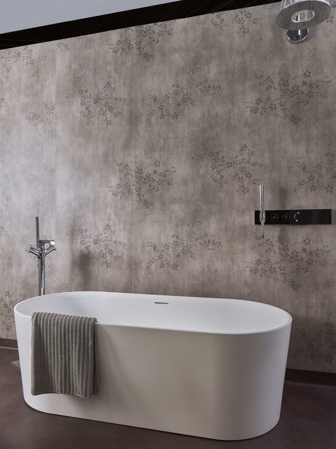 The monochromatic design scheme of this zone in the Carera Bathroom showroom highlights this Laufen free standing bathtub