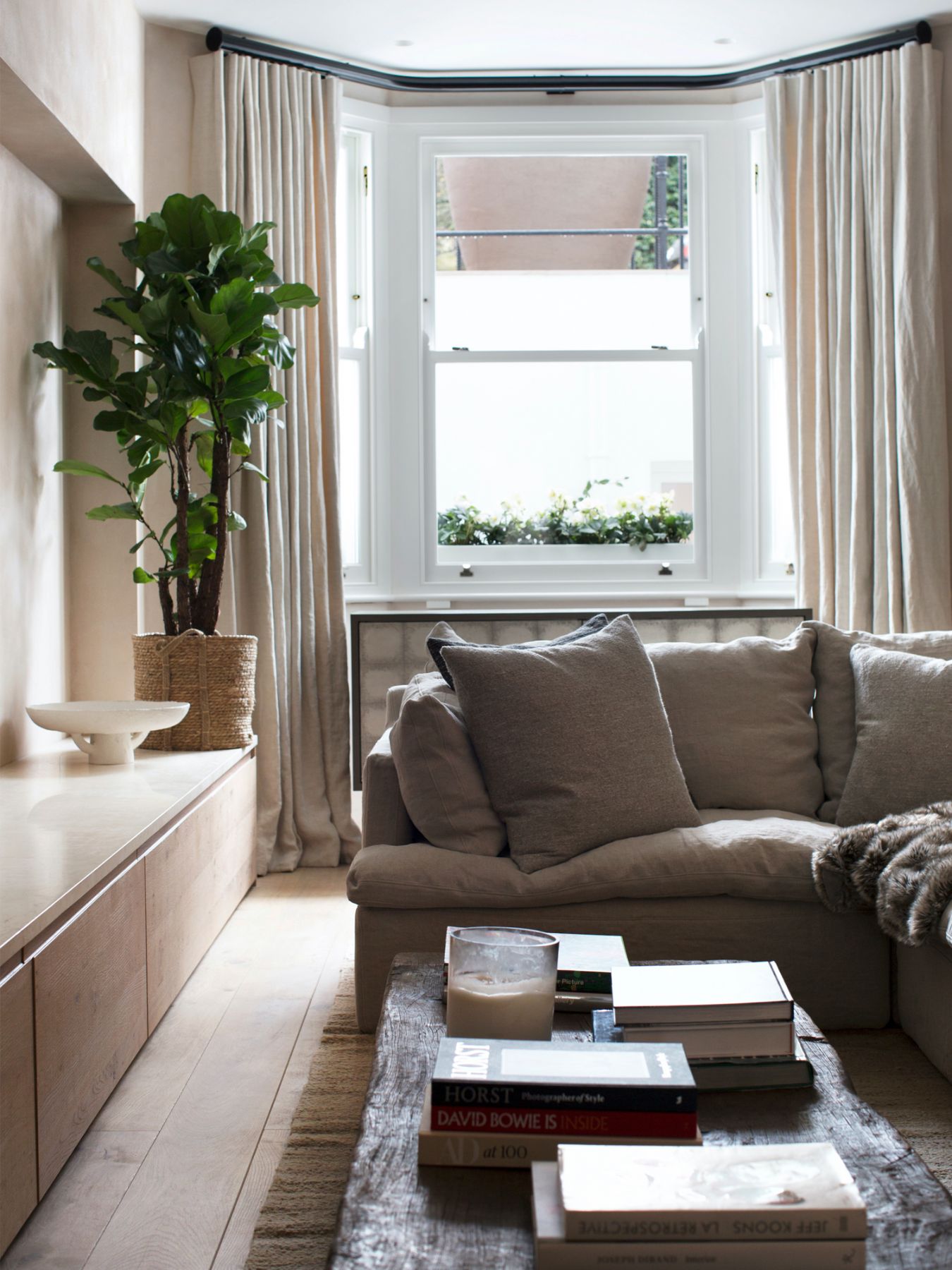 A large sectional sofa from Timothy Oulton is the visual focus of the informal living room