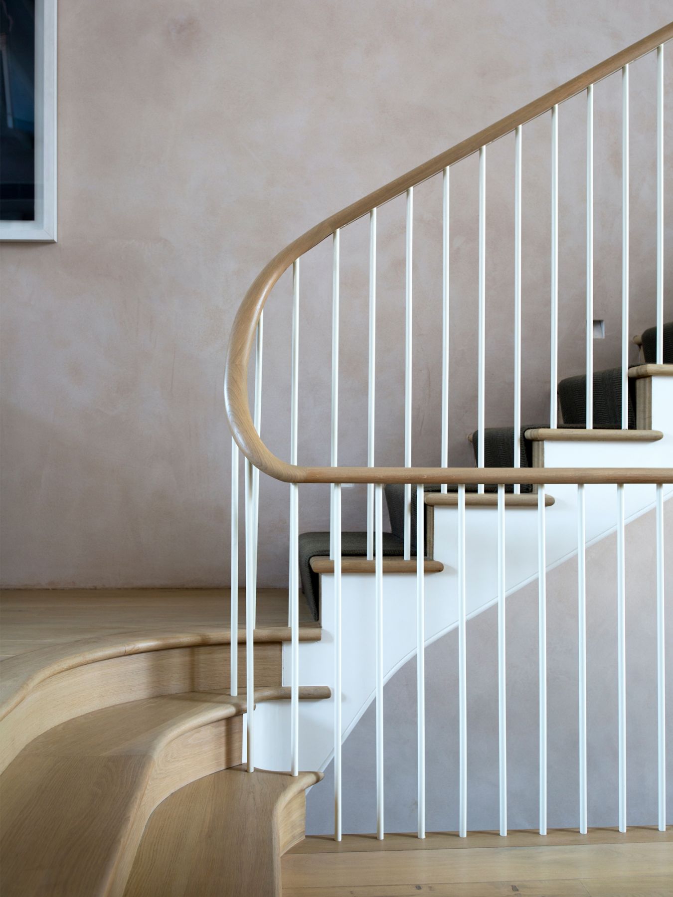 The bespoke double-height main staircase creates better flow in the home and maximises space