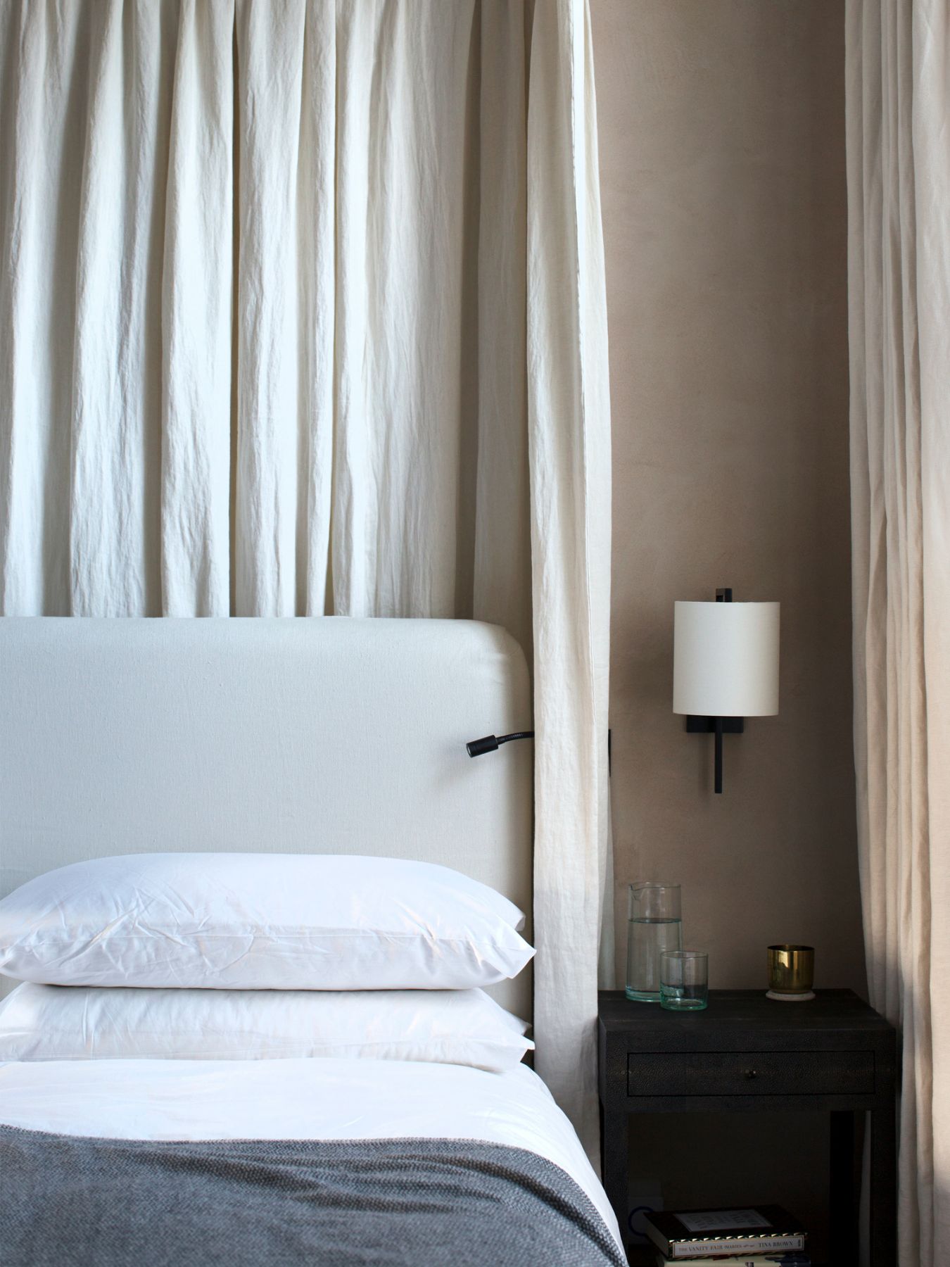 Natural materials and textiles accompany a serene colour palette in the master bedroom