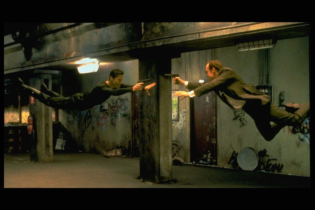Keanu Reeves and Hugo Weaving face each other in a scene from Andy and Larry Wachowski's 1999 movie The Matrix. In this scene, Neo (Reeves) fights the computerized Agent Smith (Weaving). (Photo by Ronald Siemoneit/Sygma/Sygma via Getty Images)