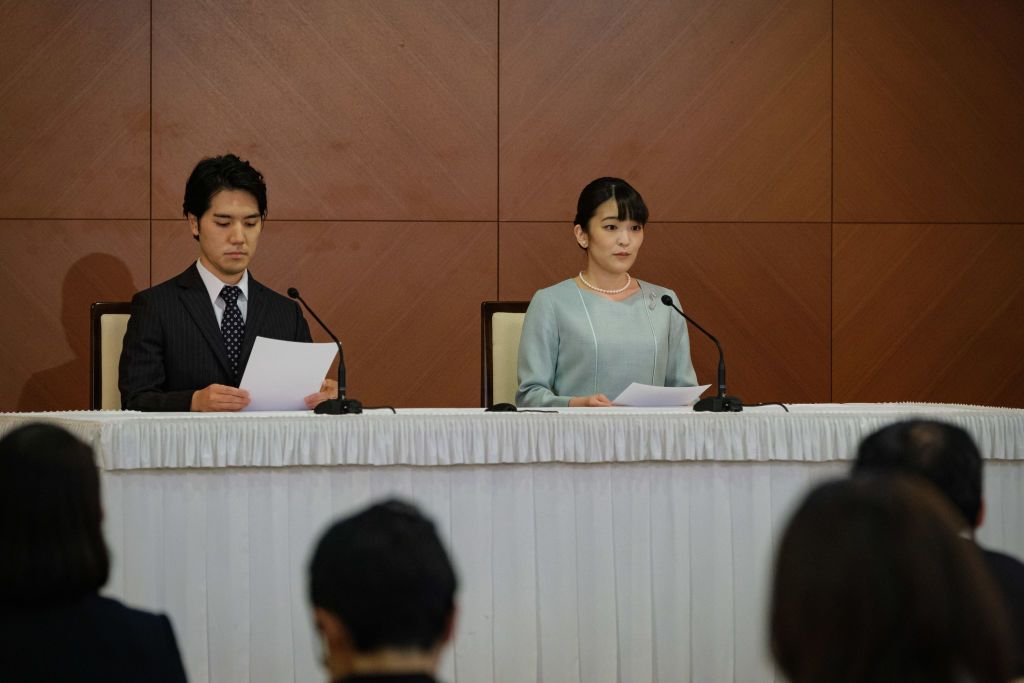 TOKYO, JAPAN - OCTOBER 26: Princess Mako, the elder daughter of Prince Akishino and Princess Kiko, and her husband Kei Komuro, a university friend of Princess Mako, deliver a speech during a press conference to announce their wedding at Grand Arc Hotel on October 26, 2021 in Tokyo, Japan. Princess Mako married Kei Komuro today at a registry office following a relationship beset with controversy following the revelation that Mr Komuroâs mother was embroiled in a financial dispute with a former fiancé. Fol