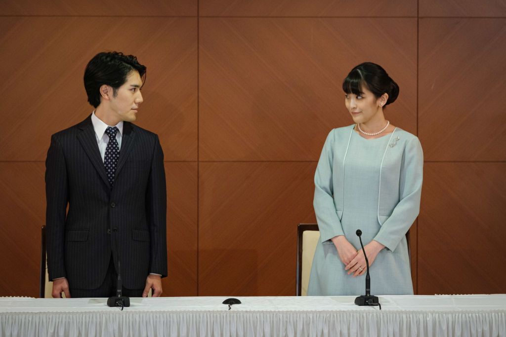 TOKYO, JAPAN - OCTOBER 26: Princess Mako, the elder daughter of Prince Akishino and Princess Kiko, and her husband Kei Komuro, a university friend of Princess Mako, poses during a press conference to announce their wedding at Grand Arc Hotel on October 26, 2021 in Tokyo, Japan. Princess Mako married Kei Komuro today at a registry office following a relationship beset with controversy following the revelation that Mr Komuroâs mother was embroiled in a financial dispute with a former fiancé. Following the