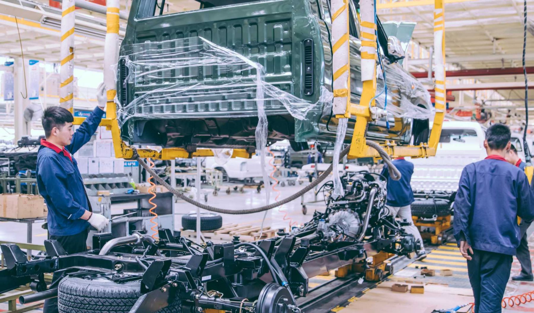 Workers in an automoble factory in Beijing,China.