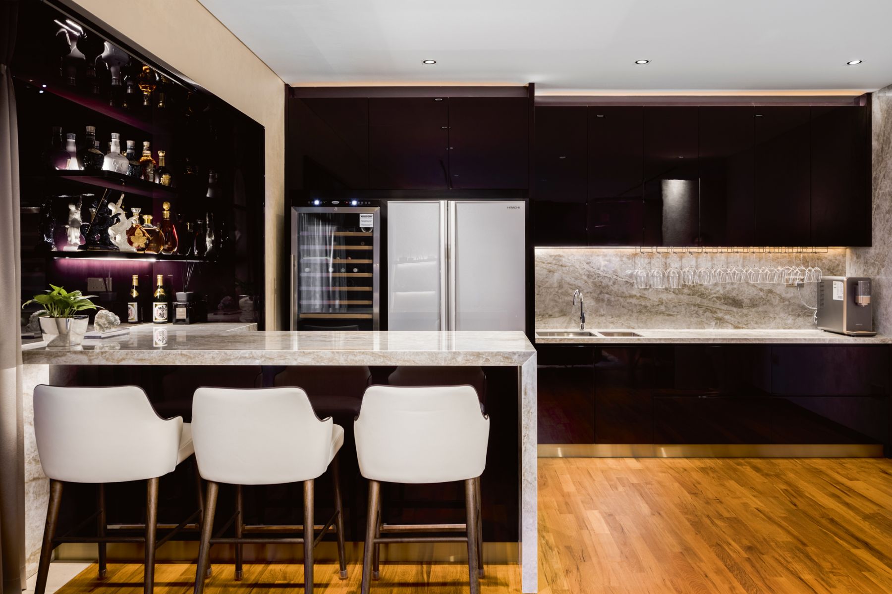 The monochromatic bar area is one of the family’s favourite places in their home