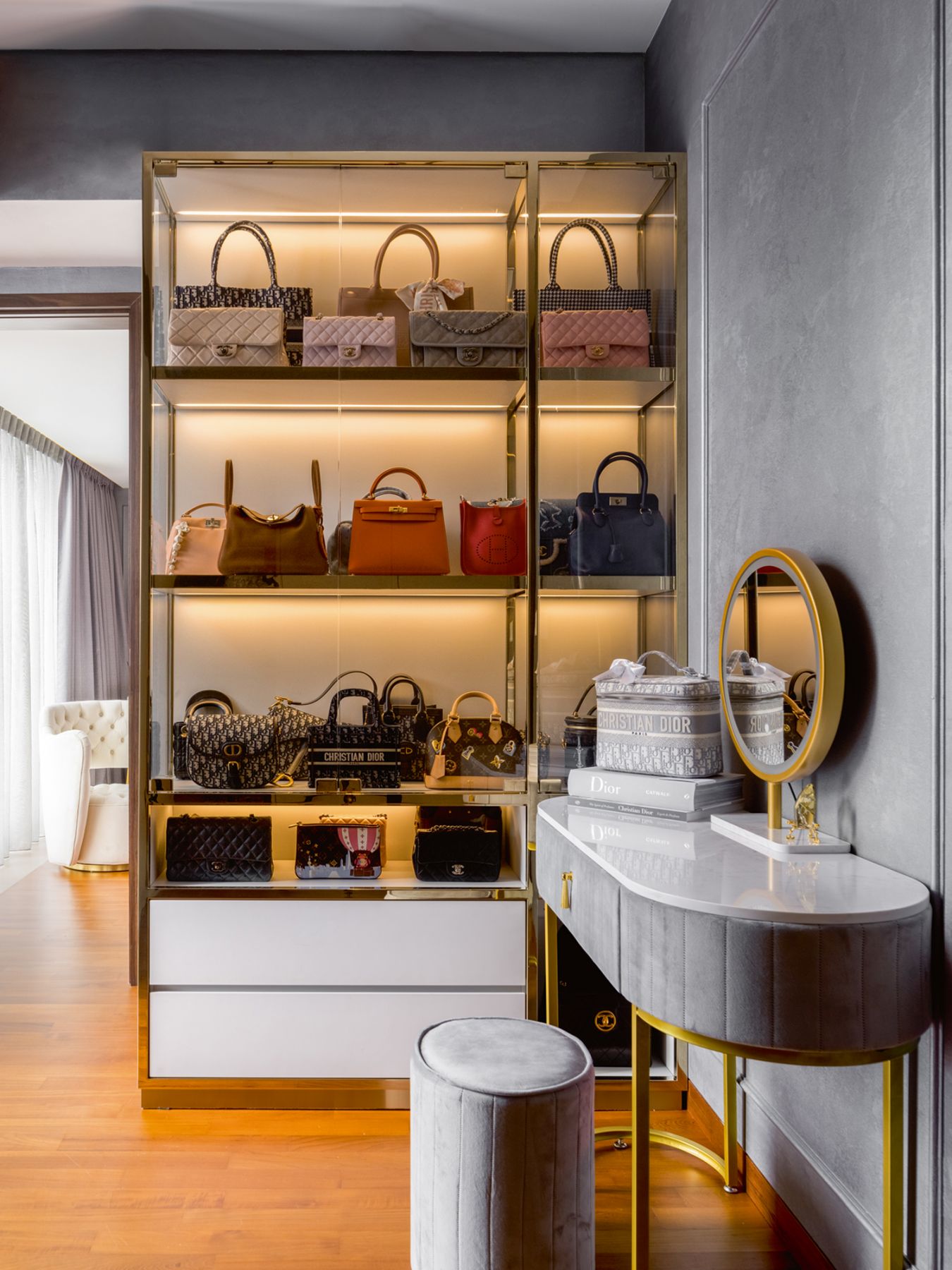 This glass cabinet displays the daughter’s favourite bags in her wardrobe area