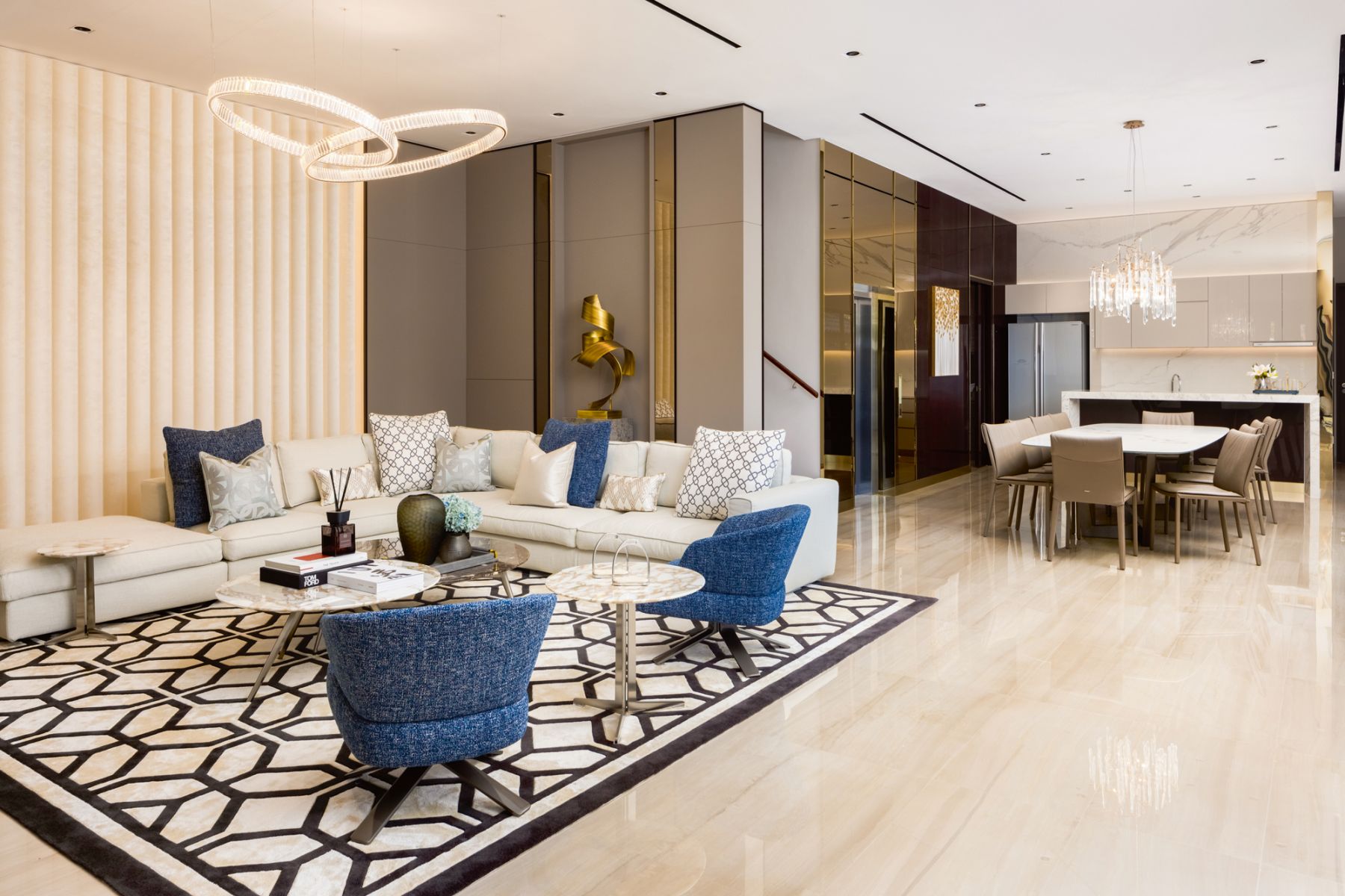 A geometric rug anchors the living area while delineating it from the dining zone