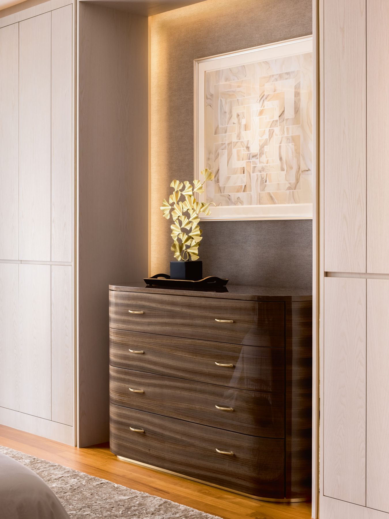 This bespoke sideboard in the master bedroom provides additional storage while fitting elegantly in a nook