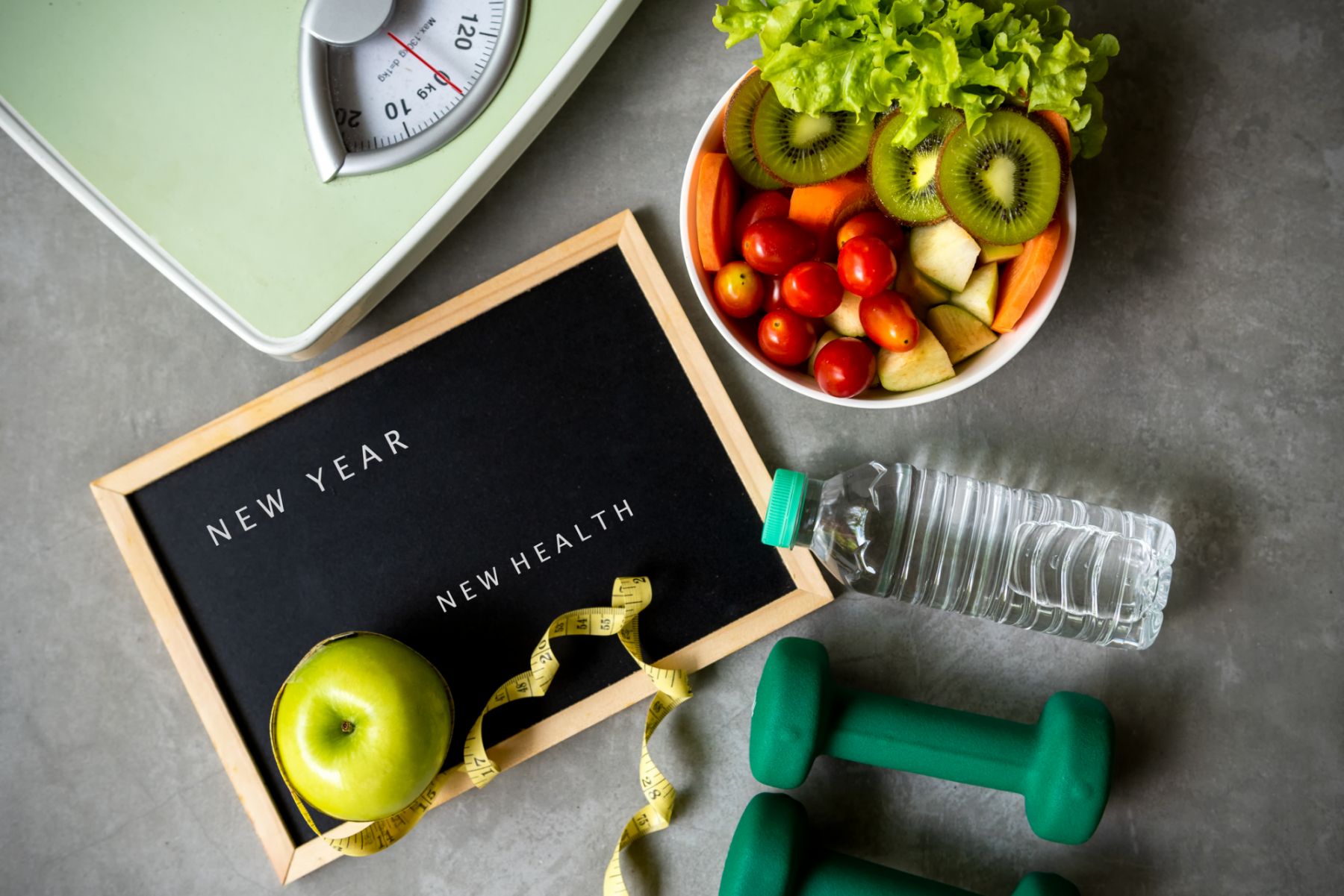 New Year for New Healthy 2021. Fresh vegetable salad and healthy food for sport equipment for women diet slimming weight loss background. Healthy change new life Concept