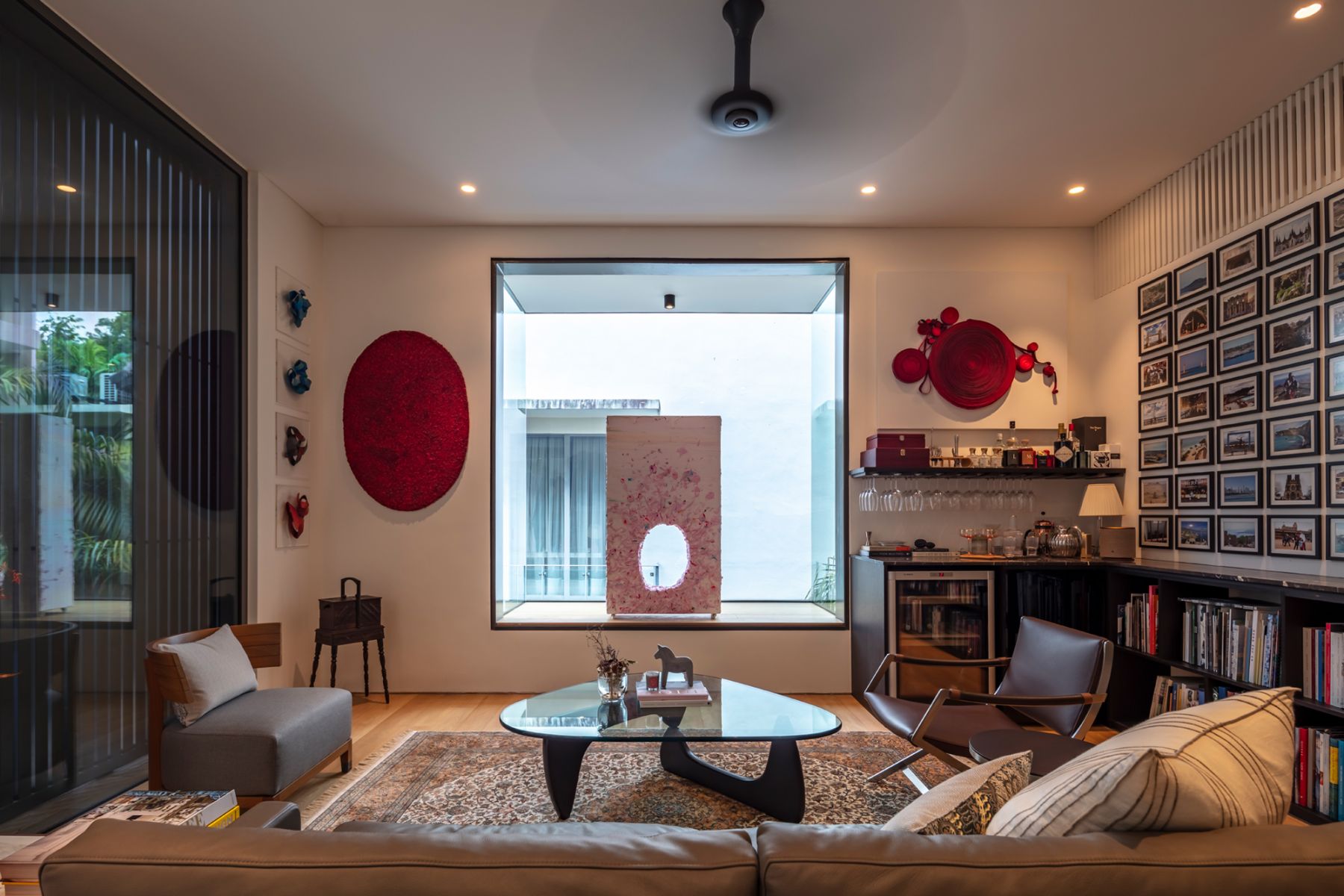 The home bar entertainment zone features a plethora of artworks as well as the Noguchi coffee table