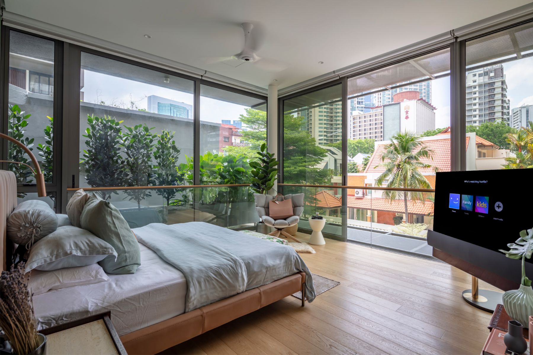 The bed in the master bedroom is positioned to look out onto the verdant views