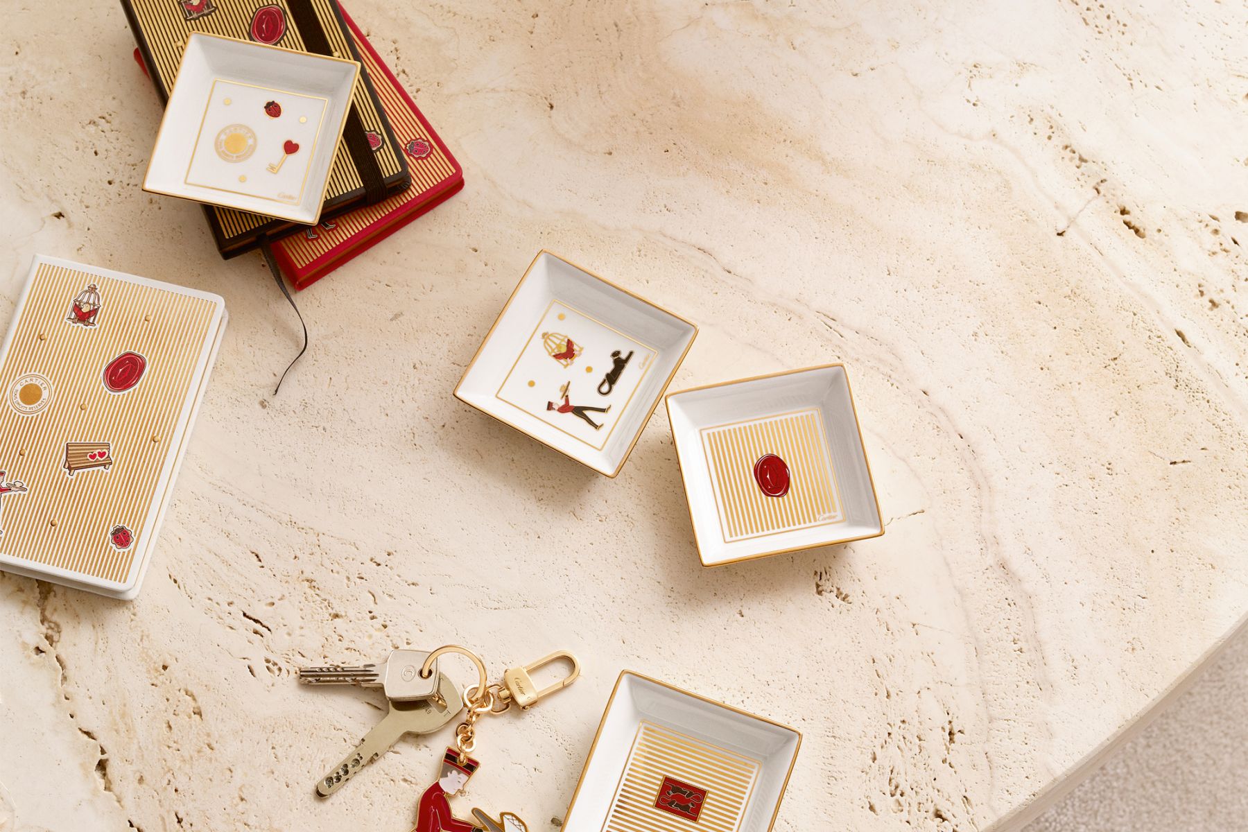 Diabolo notebooks, trinket trays and key ring, from Cartier