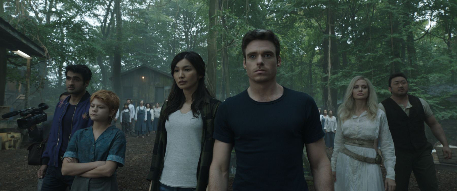 (L-R): Karun (Harish Patel), Kingo (Kumail Nanjiani), Sprite (Lia McHugh), Sersi (Gemma Chan), Ikaris (Richard Madden), Thena (Angelina Jolie), Gilgamesh (Don Lee) in Marvel Studios' ETERNALS. Photo courtesy of Marvel Studios. ©Marvel Studios 2021. All Rights Reserved.