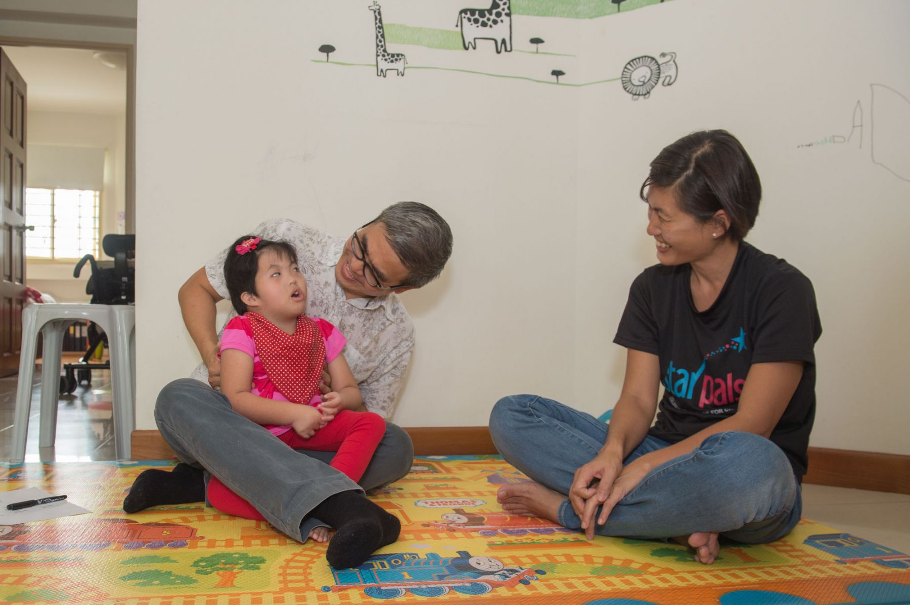 Dr Chong visiting a Star PALS patient 2015