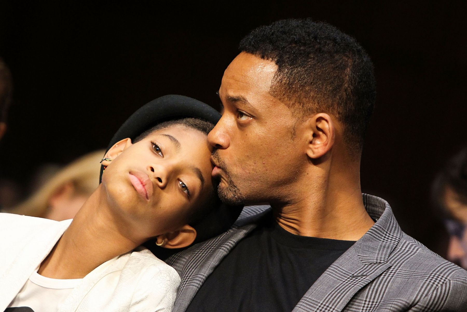 WASHINGTON, DC - JULY 17: Will Smith (R) give his daughter, Willow Smith, a kiss during the "The Next Ten Years In The Fight Against Human Trafficking: Attacking The Problem With The Right Tools" Committee Hearing at the Hart Senate Office Building on July 17, 2012 in Washington, DC. (Photo by Paul Morigi/WireImage)