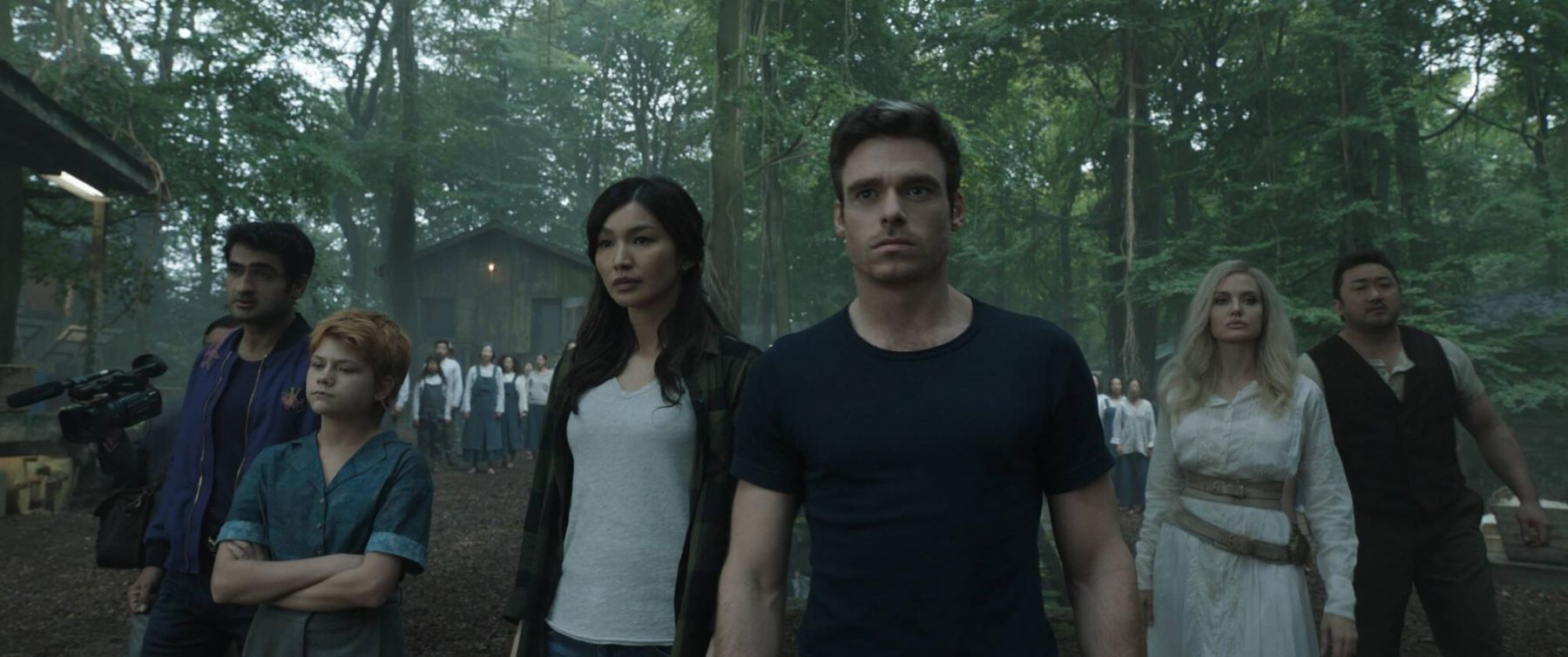 (L-R): Karun (Harish Patel), Kingo (Kumail Nanjiani), Sprite (Lia McHugh), Sersi (Gemma Chan), Ikaris (Richard Madden), Thena (Angelina Jolie), Gilgamesh (Don Lee) in Marvel Studios' ETERNALS. Photo courtesy of Marvel Studios. ©Marvel Studios 2021. All Rights Reserved.