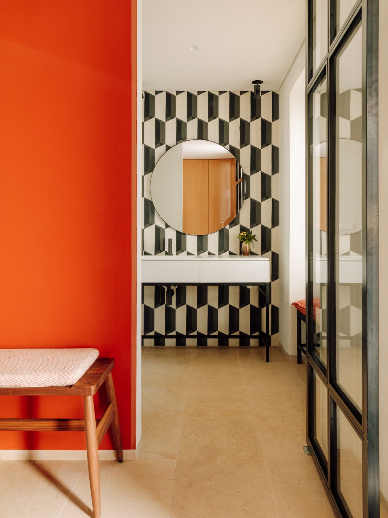 The powder room is a vibrant escape with bold colours and patterns