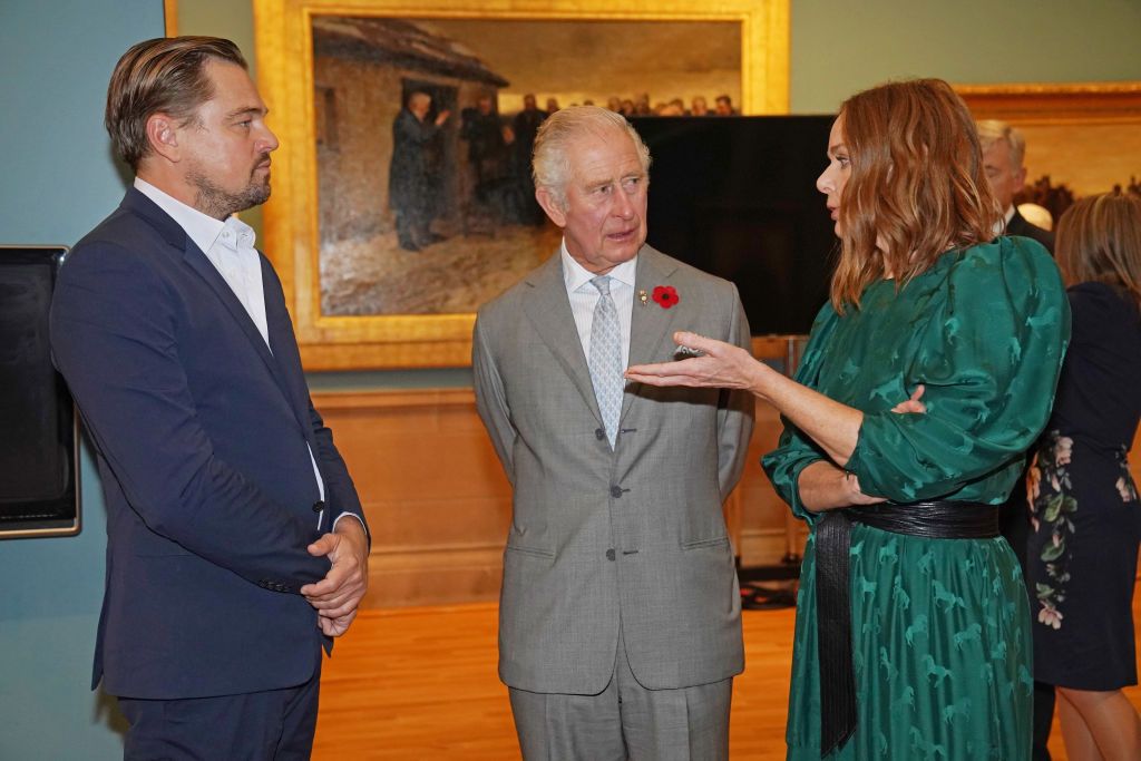 GLASGOW, SCOTLAND - NOVEMBER 03: Prince Charles, Prince of Wales speaks with Leonardo DiCaprio as he views a fashion installation by designer Stella McCartney, at the Kelvingrove Art Gallery and Museum, during the Cop26 summit being held at the Scottish Event Campus (SEC) on November 3, 2021 in Glasgow, Scotland. 2021 sees the 26th United Nations Climate Change Conference which will run from 31 October for two weeks, finishing on 12 November. It was meant to take place in 2020 but was delayed due to the Cov