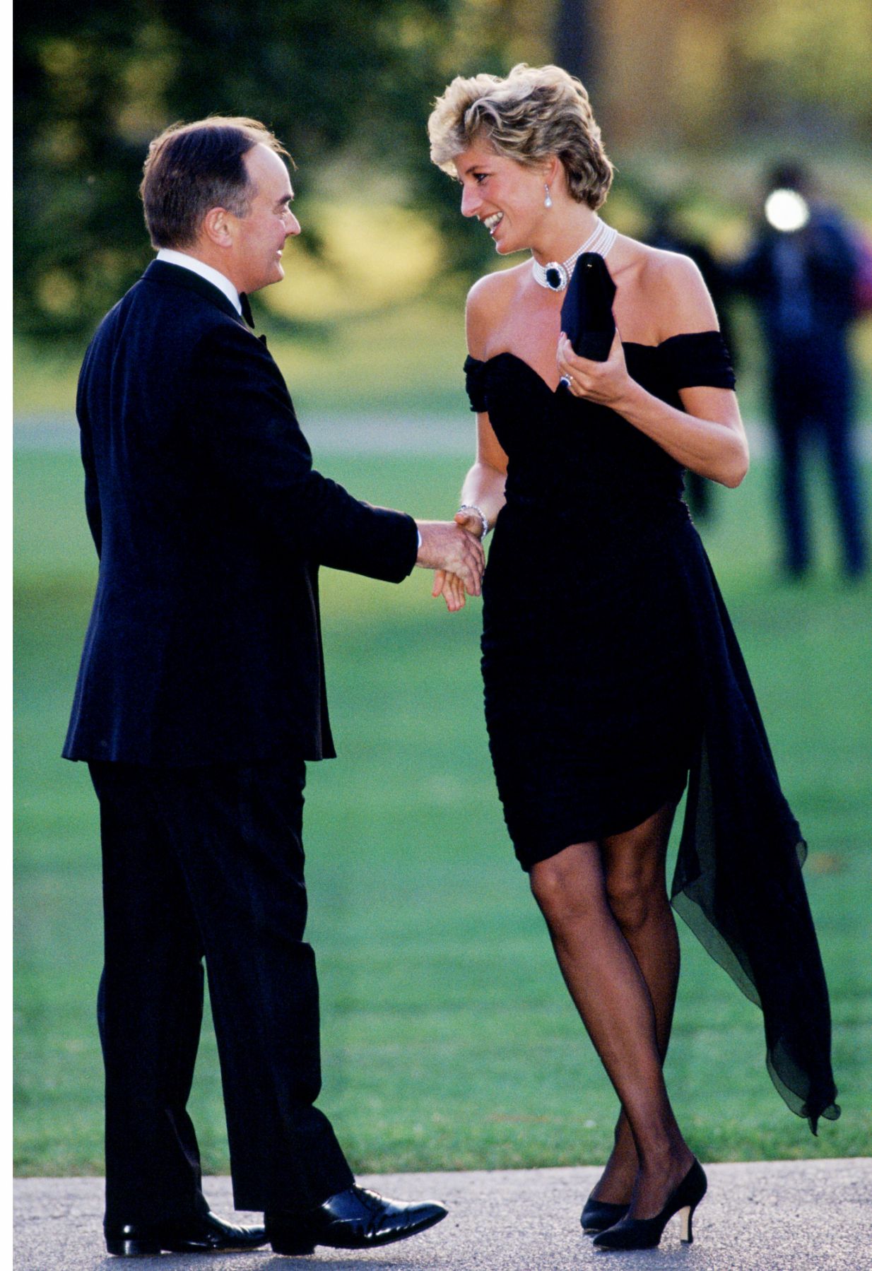 LONDON - JUNE 29: (FILE PHOTO) Lord Palumbo greets Princess Diana, wearing a short black cocktail dress designed by Christina Stambolian, as she atttends a Gala at the Serpentine Gallery in Hyde Park on June 29, 1994 in London, England. (Photo by Tim Graham Photo Library via Getty Images)