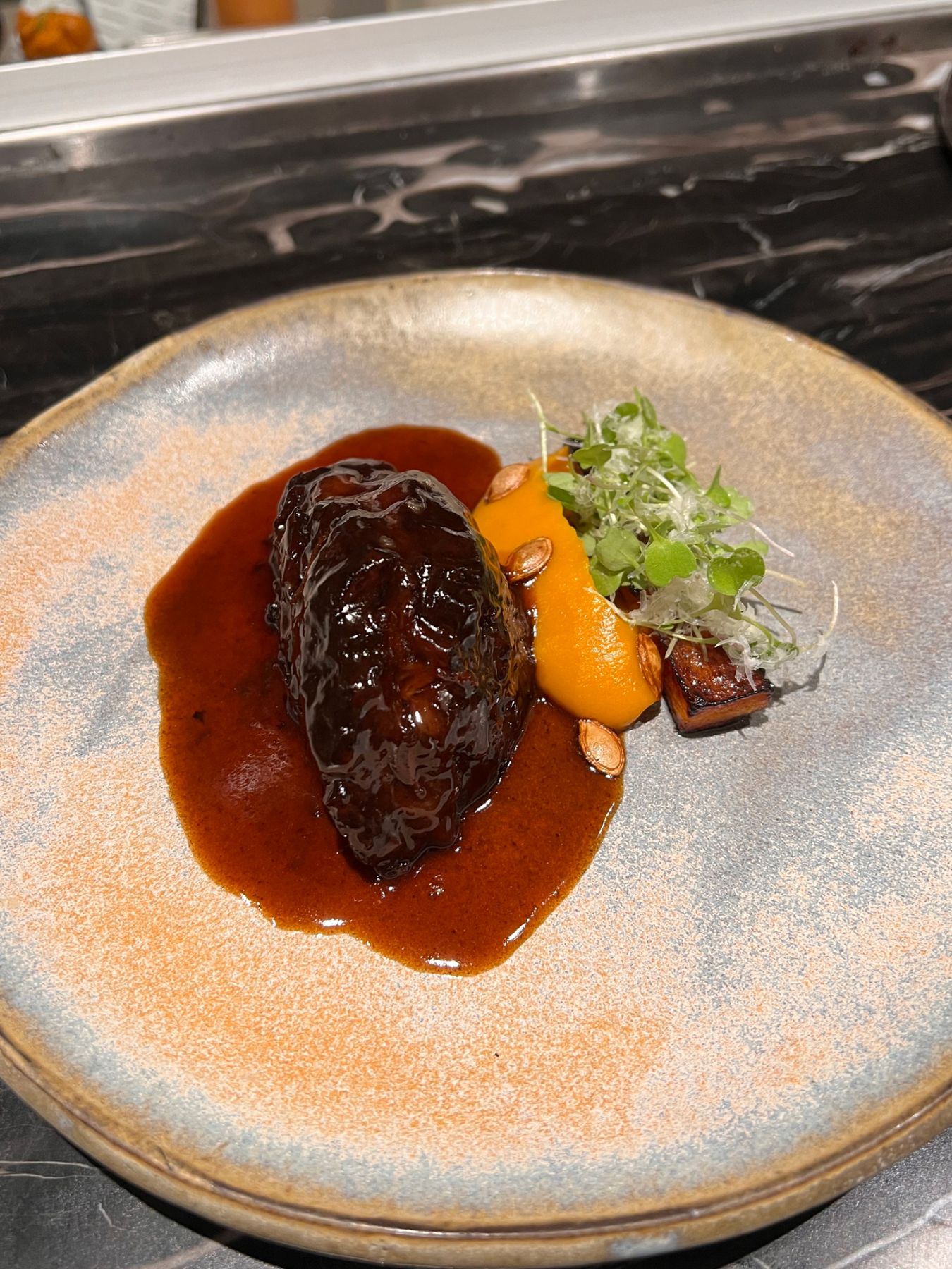 Grass-fed Australian beef cheek served with butternut squash and baby arugula