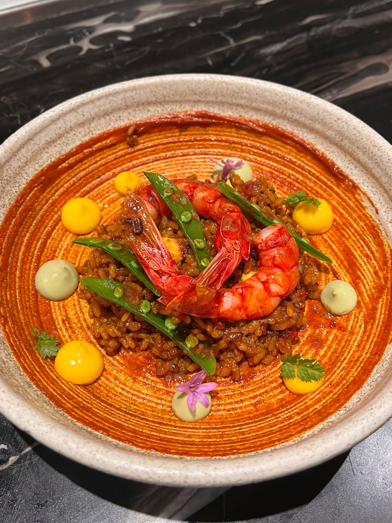 Sea urchin paella lobster rice, Murasaki uni, saffron allioli, sugar snap peas