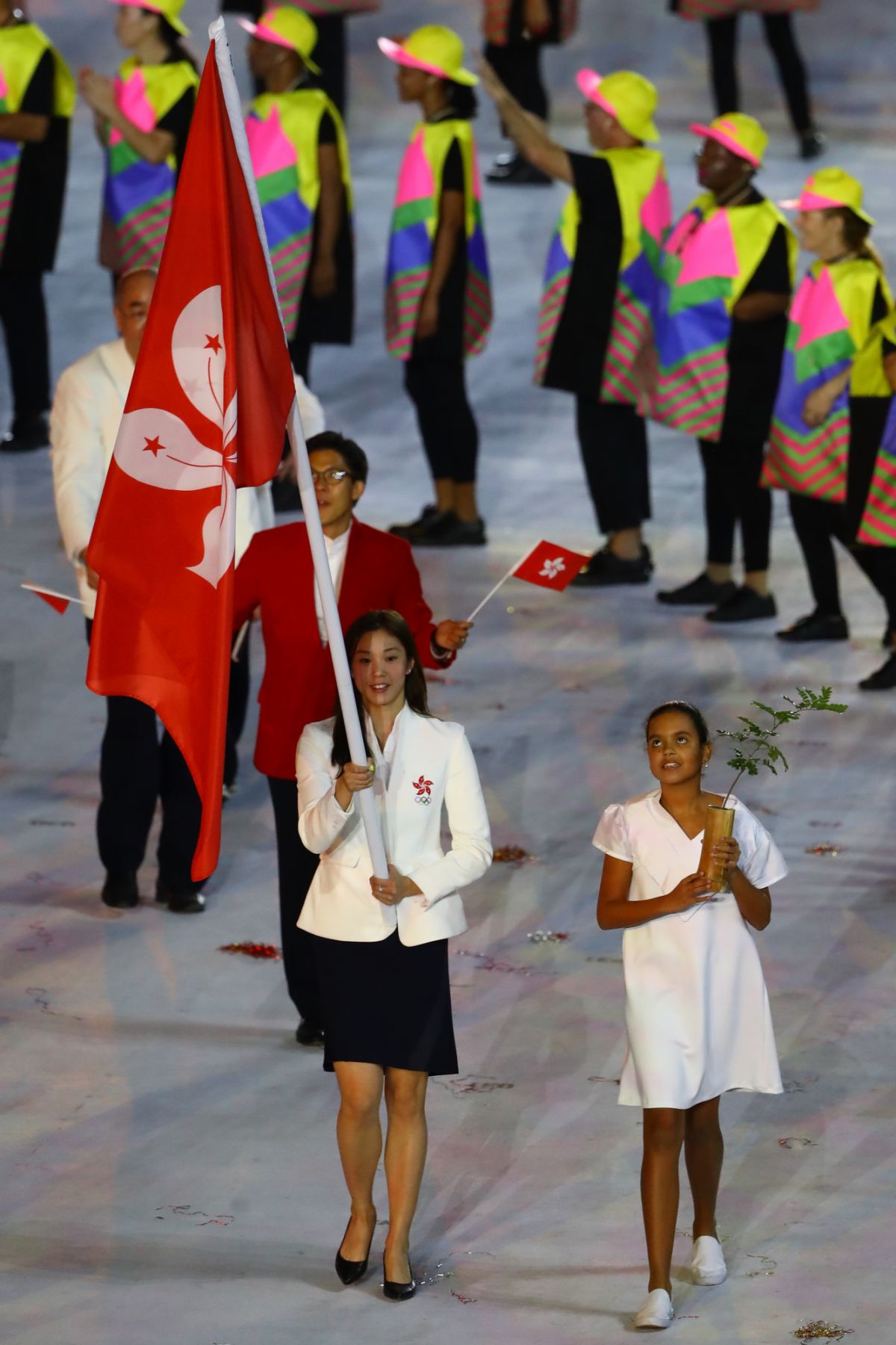 RIO DE JANEIRO, BRAZIL - AUGUST 05: Flag bearer Stephanie Au of Hong Kong, China leads her team during the Opening Ceremony of the Rio 2016 Olympic Games at Maracana Stadium on August 5, 2016 in Rio de Janeiro, Brazil. (Photo by Elsa/Getty Images)
