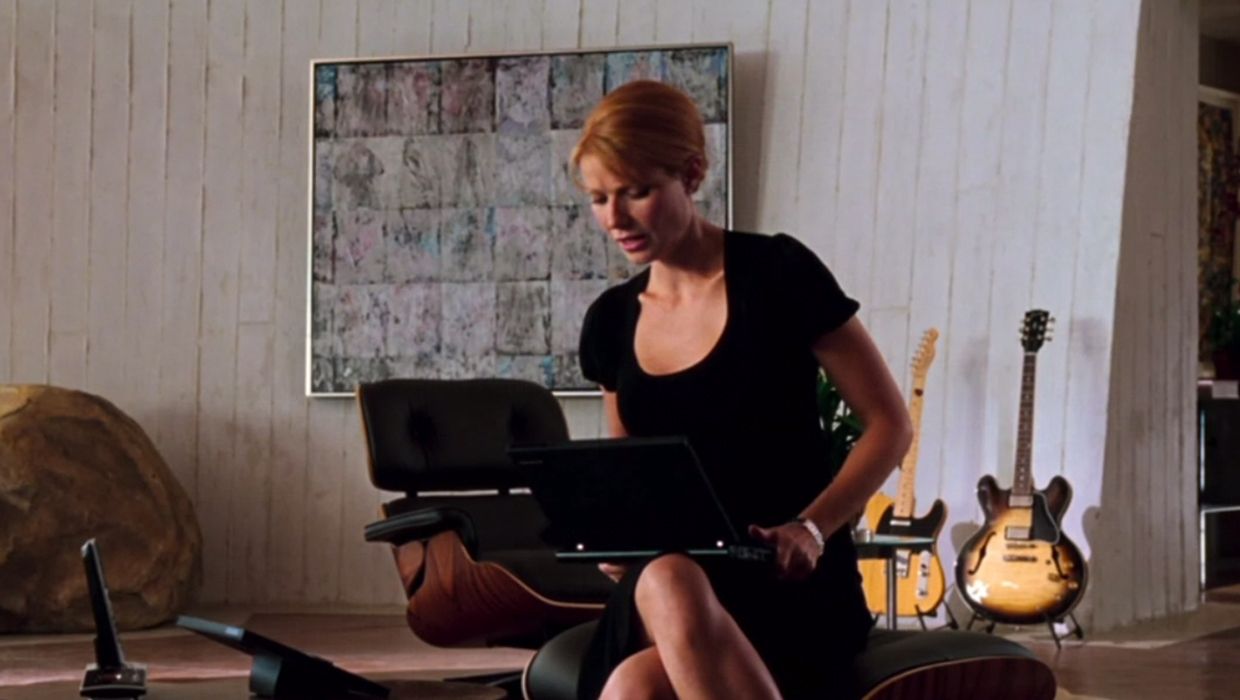 The Eames lounge chair in the background in Iron Man, while Pepper Potts (Gwyneth Paltrow) sits on the ottoman (Image: ABC, no copyright infringement intended.)