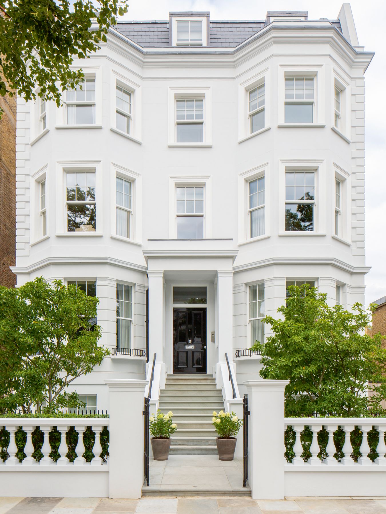 The elegant white facade of the abode