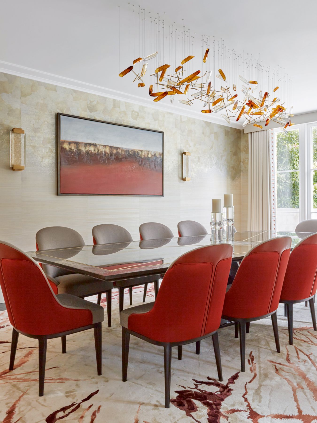 Hand-painted Fromental wallpaper panels echo the use of blue tones in the drawing room