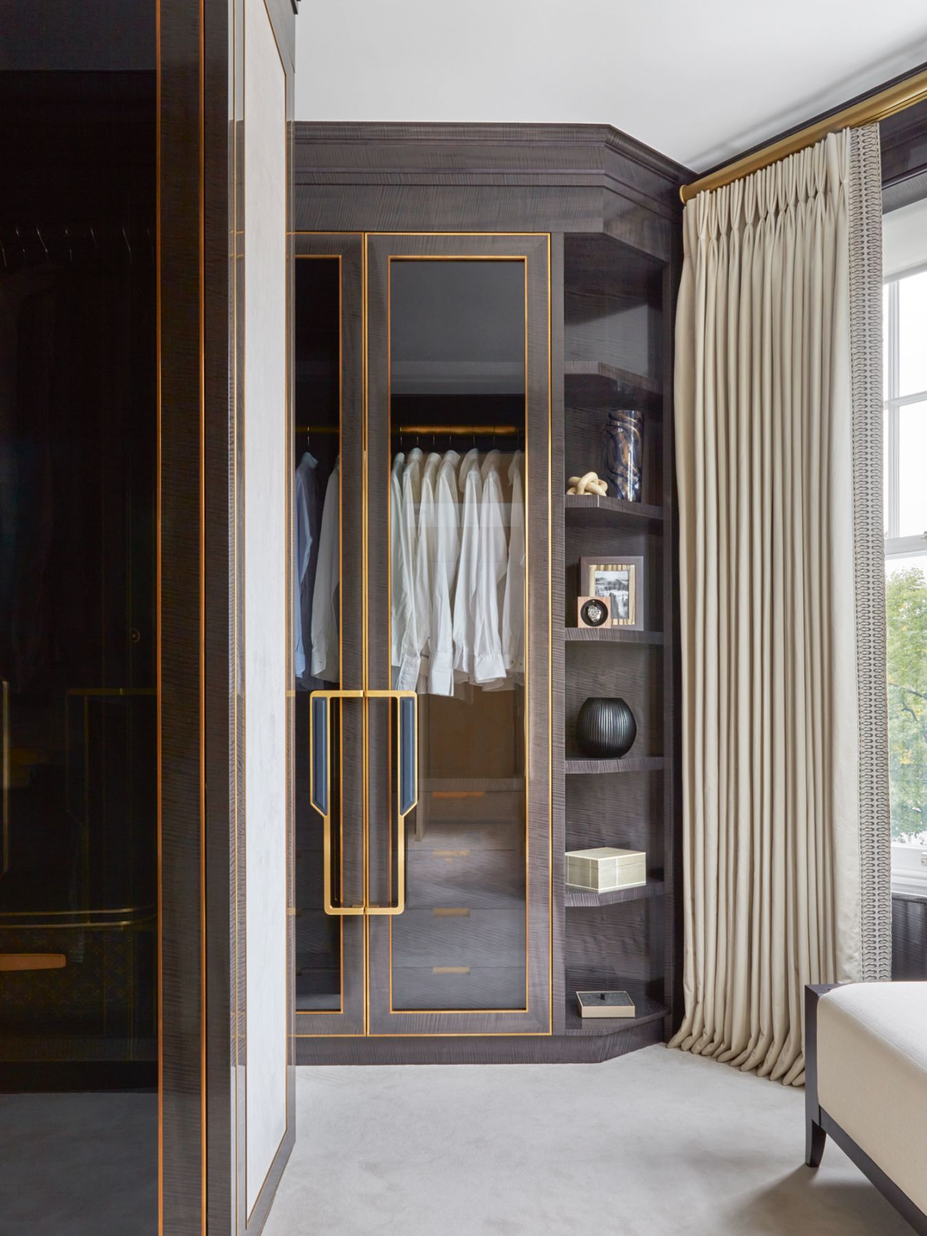 The metal inlays on this wardrobe are a recurring element used on joinery throughout the home