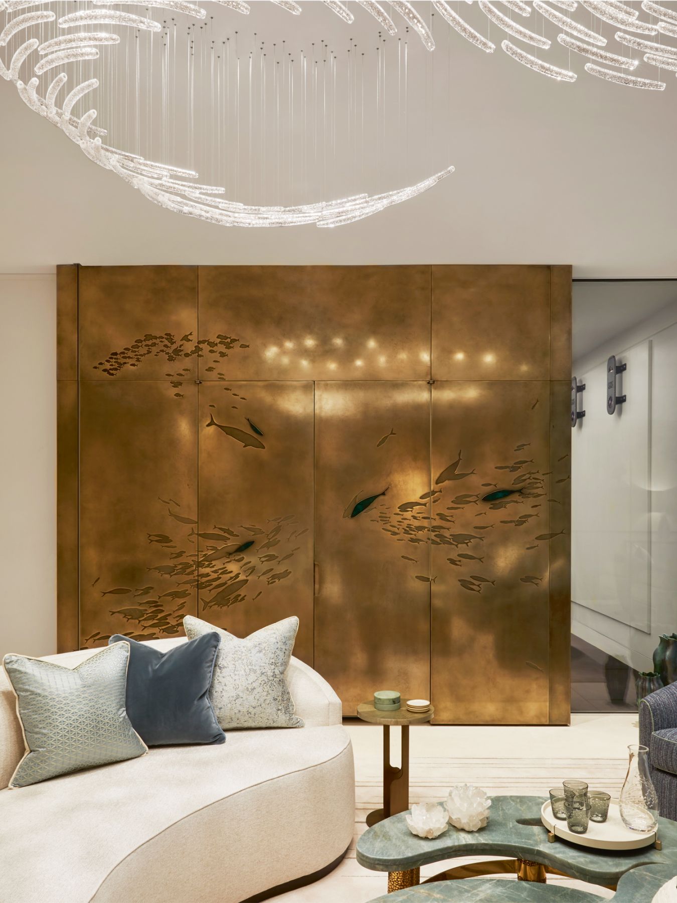 Fish motifs add a touch of whimsy to the bronze feature wall