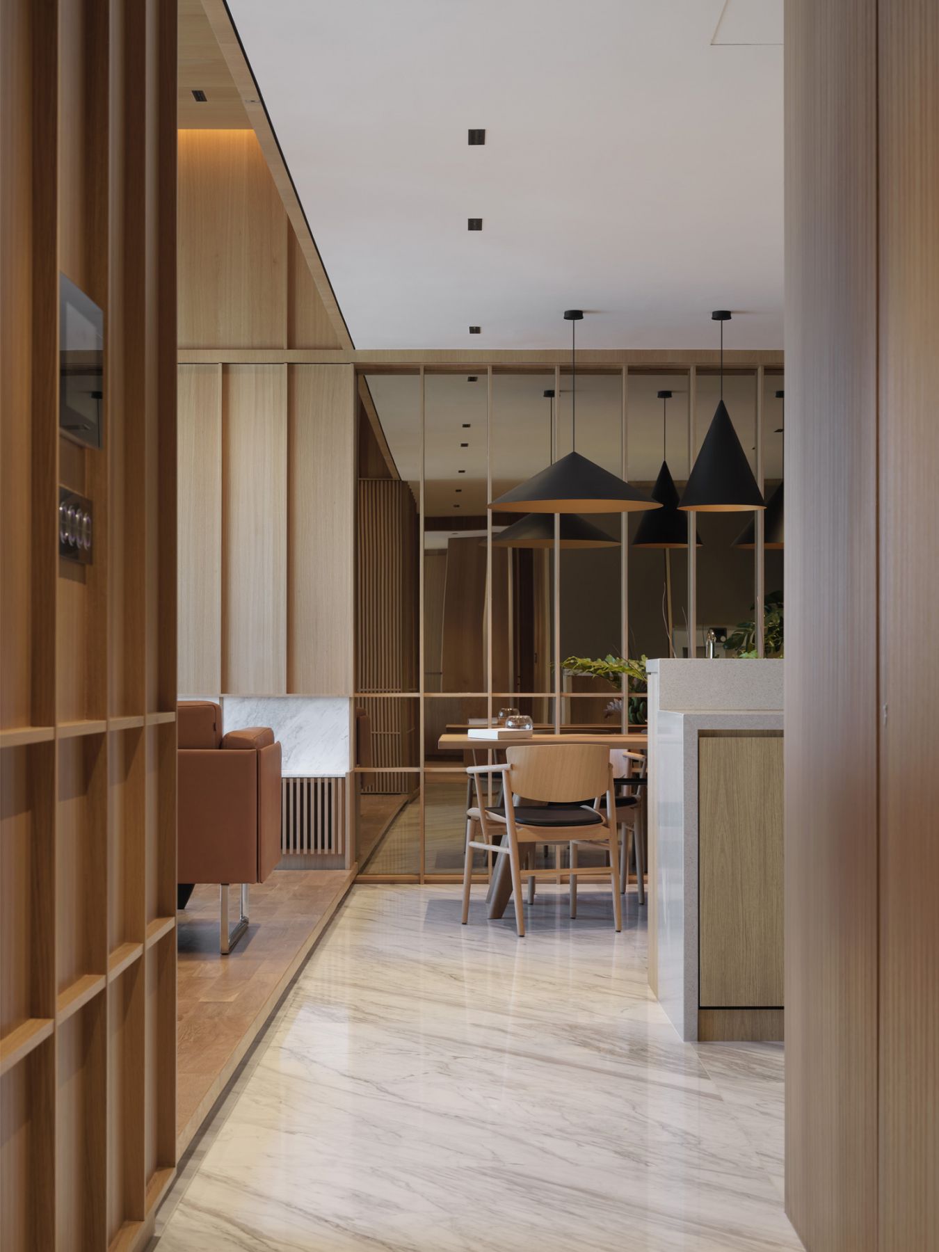 Clad in warm tones with a refined material palette, the abode speaks to the Japanese style of minimalism