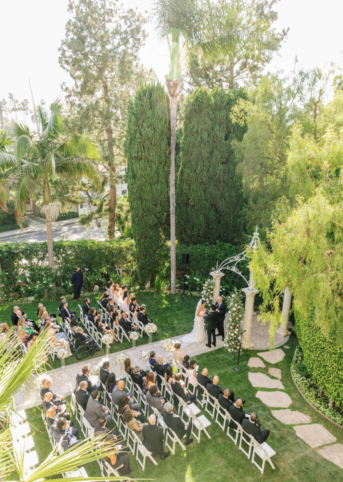 The ceremony held at Crystal Garden, The Beverly Hills Hotel, officiated by JP Reynolds