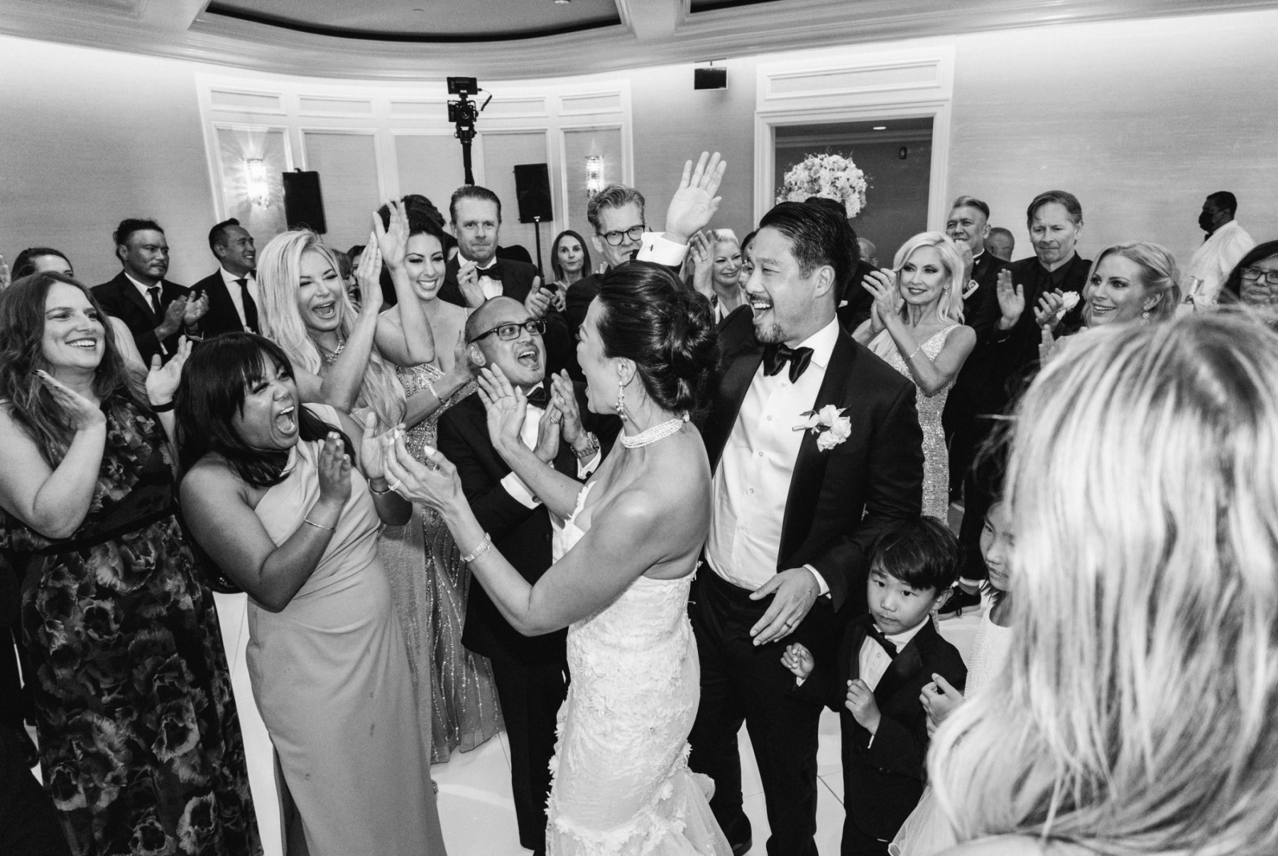 The newlyweds dance with the guests at the reception