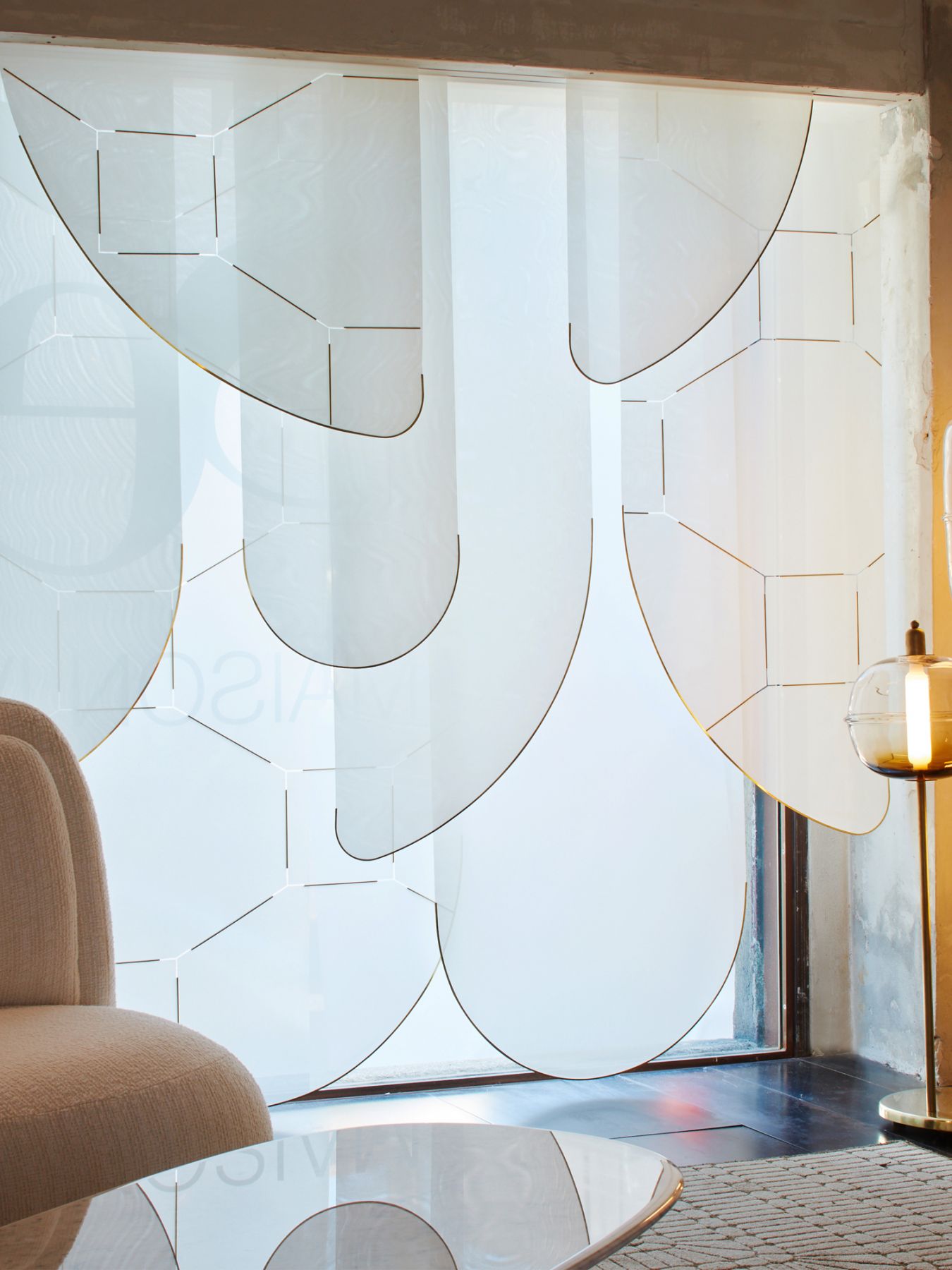 The layered panels feature curved edges and are lined with gleaming metal accents