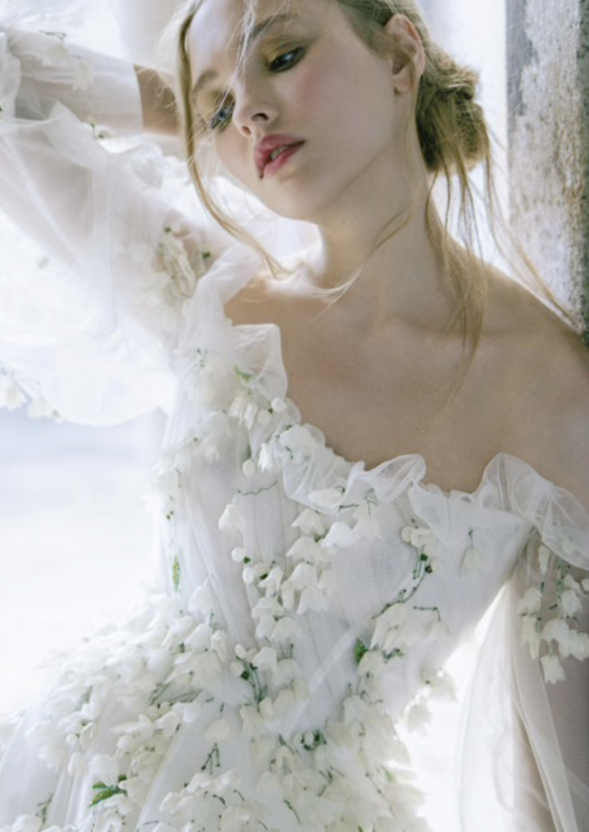 Floral details draw the eyes to this stunning number from the spring 2022 bridal collection