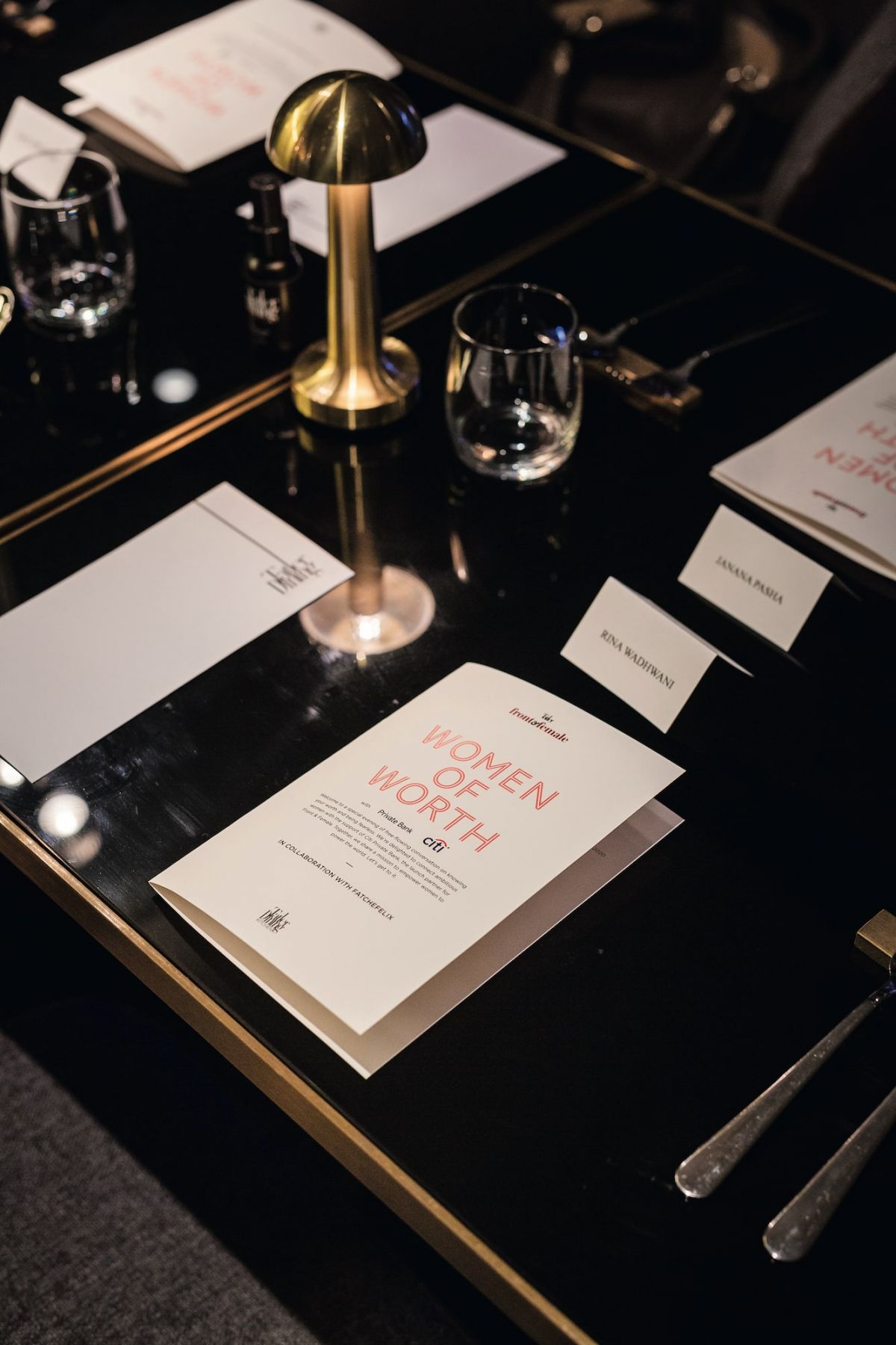 Menu and table setting at a Women of Worth dinner hosted by Front & Female and Citi Private Bank