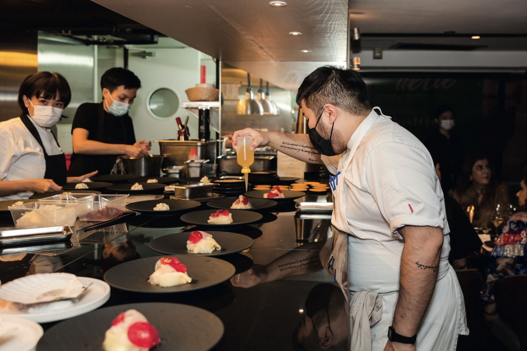 Chef Felix Cheung with local seafood dishes for a dinner hosted by Front & Female and Citi Private Bank