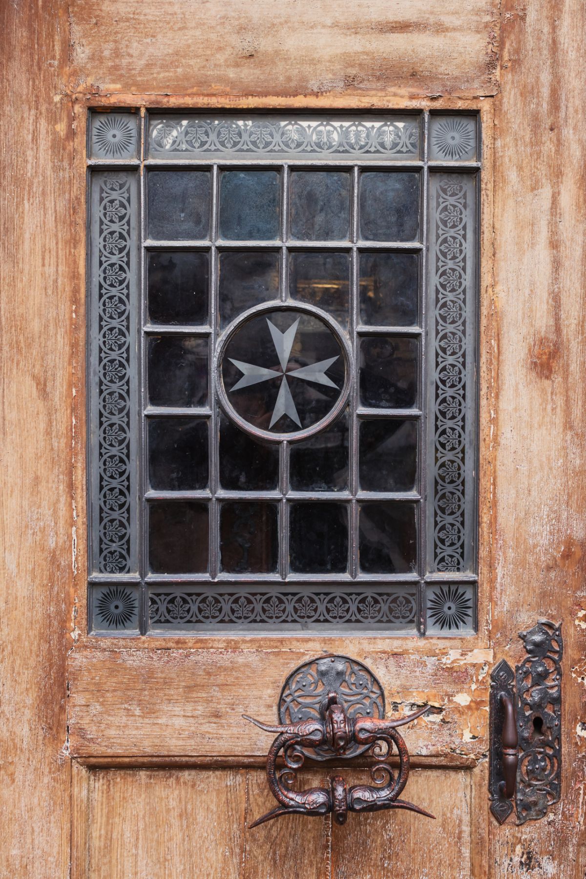 Detail of church doors of the Sovereign Military Order of Malta. Prague. Czech Republic
