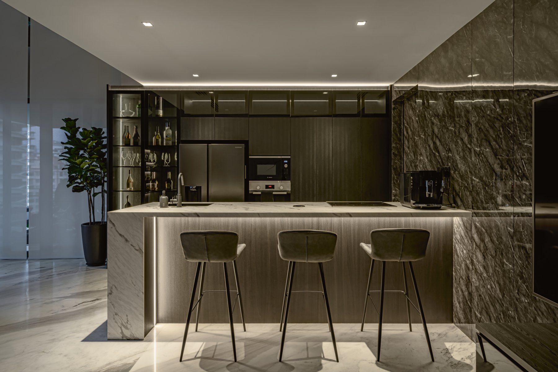 The kitchen island is a popular spot where the couple gather for quick meals and drinks with friends after a busy day