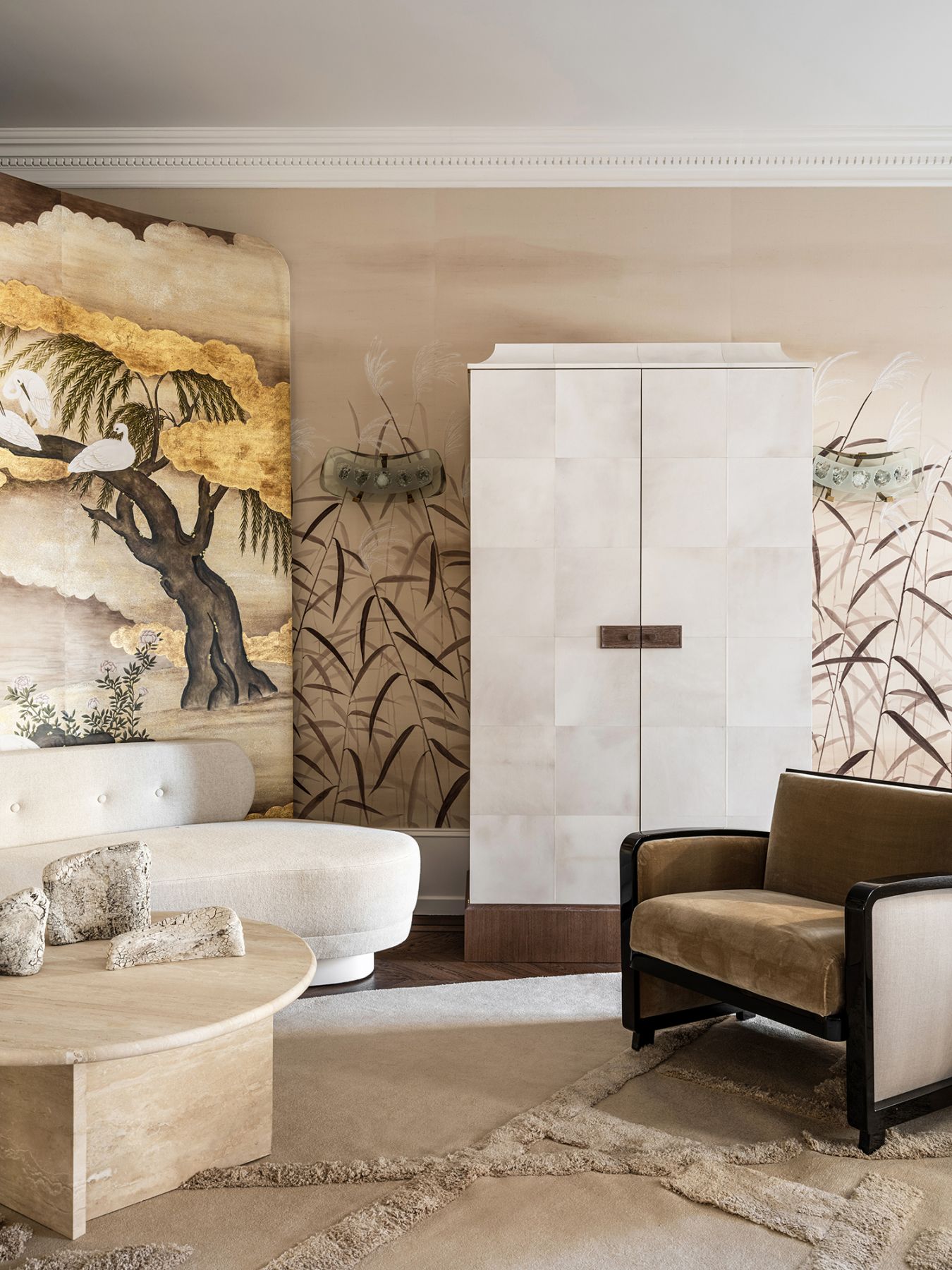 A tall cabinet covered in white parchment is amongst the home's many bespoke items crafted by Zaria