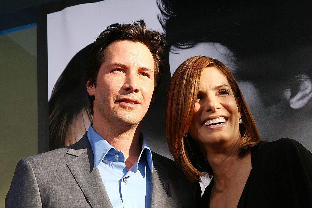LOS ANGELES - JUNE 13: Actors Keanu Reeves (L) and Sandra Bullock arrive at the premiere of Warner Bros. Pictures' "The Lake House" at the Cinerama Dome on June 13, 2006 in Los Angeles, California. (Photo by Kevin Winter/Getty Images)