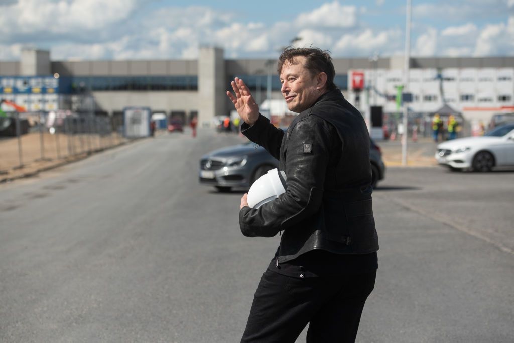 17 May 2021, Brandenburg, GrÃ¼nheide: Elon Musk, Tesla CEO, stands on the construction site of the Tesla factory and waves. He has taken a look at the progress of construction of the new factory in GrÃ¼nheide near Berlin, which will probably start production several months later than originally planned. The 49-year-old did not initially comment on Monday. Photo: Christophe Gateau/dpa (Photo by Christophe Gateau/picture alliance via Getty Images)